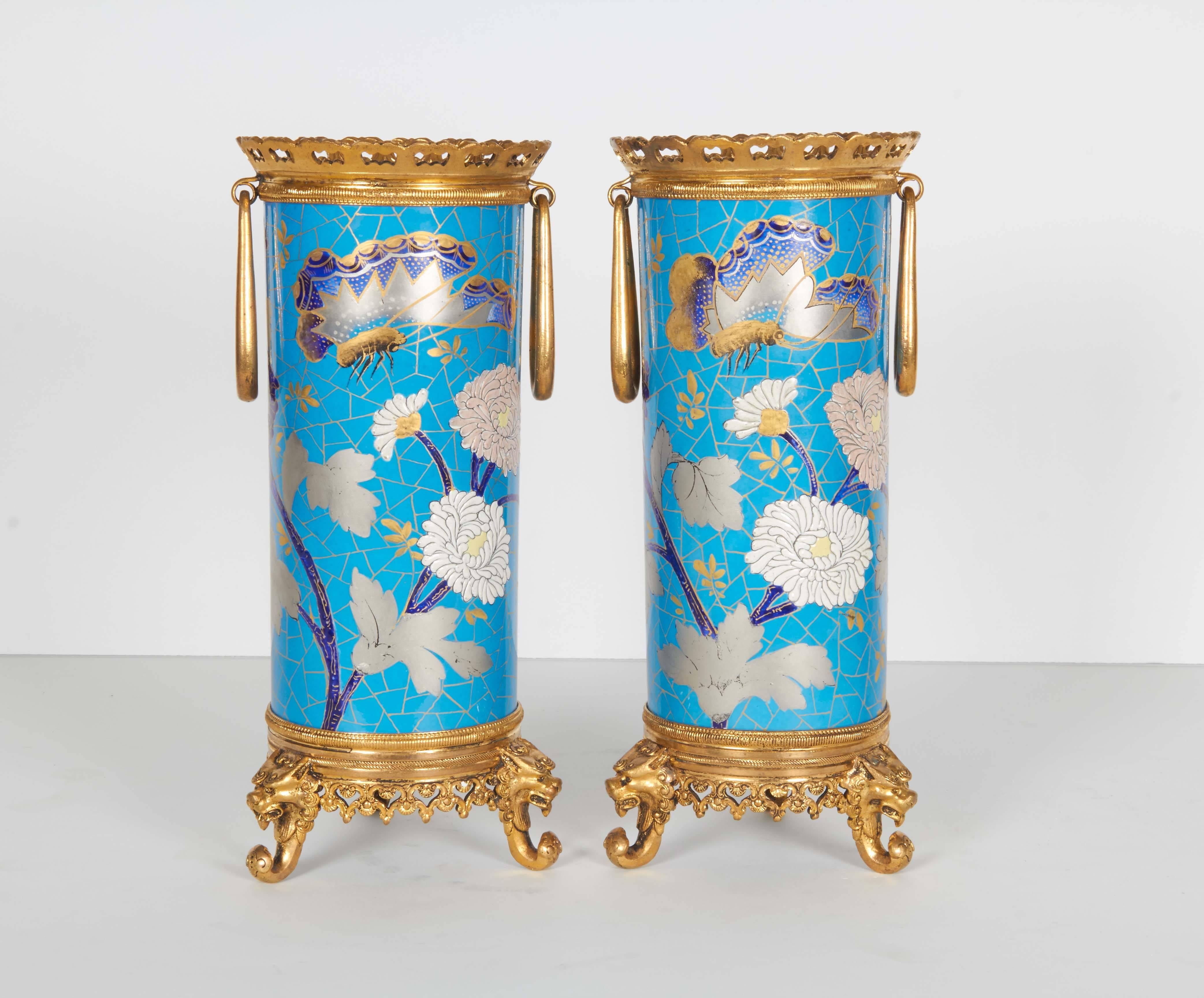 Pair of French Japonisme ormolu-mounted blue porcelain vases signed Creil et Montereau.

Very finely painted with flowers and insects. Mounted in French bronze. Signed on the bottom.
