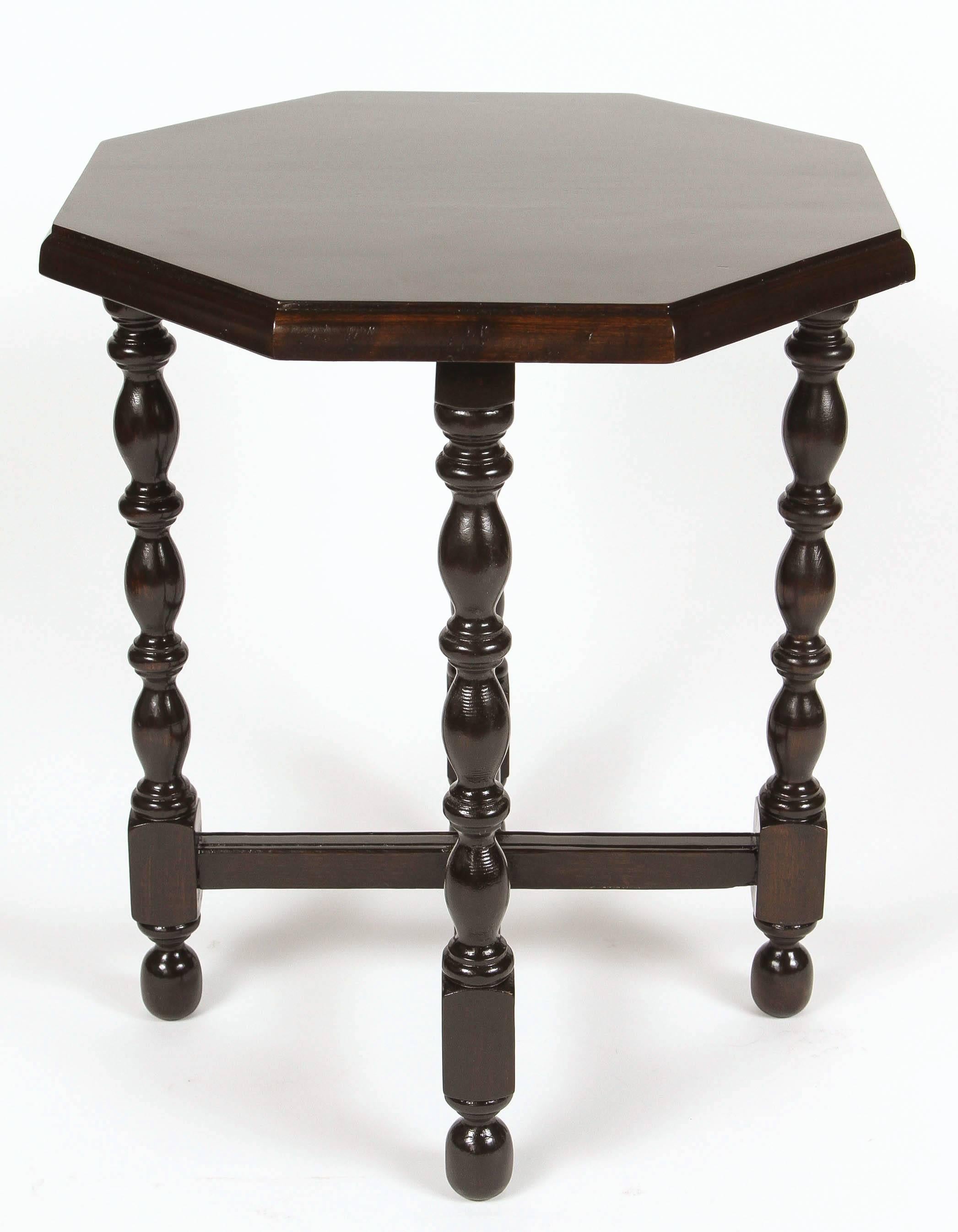 Newly refinished small, vintage walnut side table with octagon top and turned legs.
