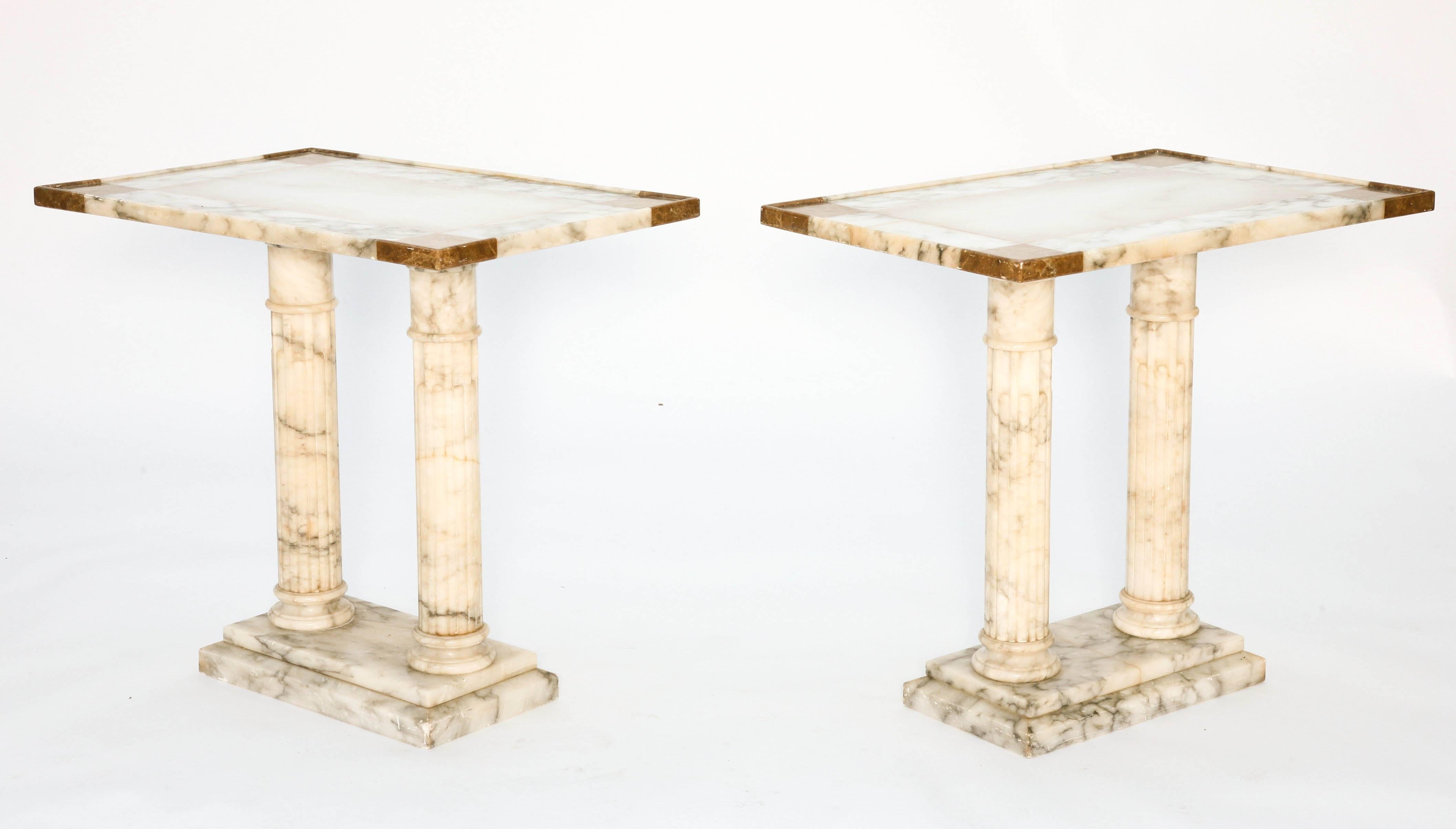 Pair of end tables of alabaster, each with a rectangular top, on double column legs, on graduated plinth.

Stock ID: D9379