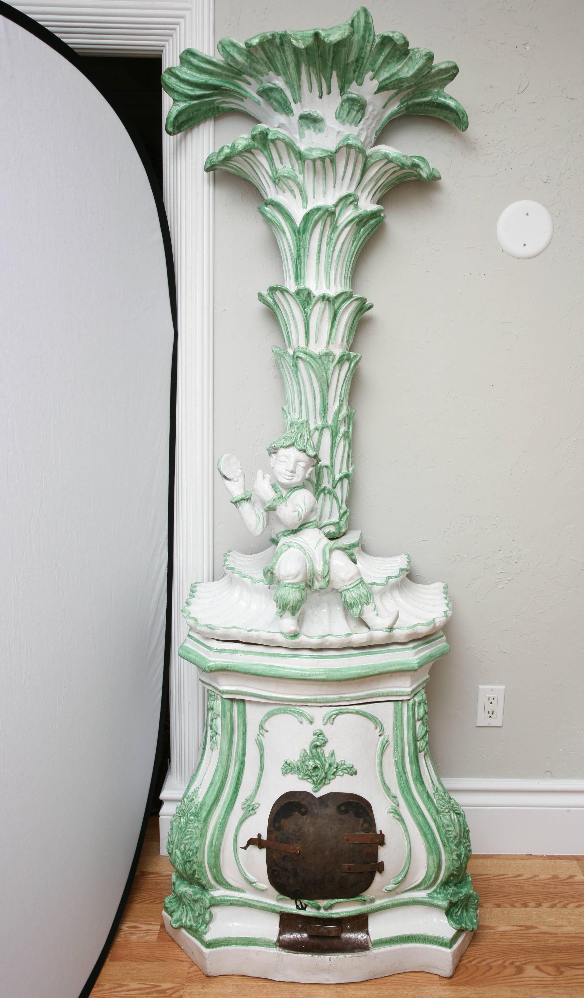 Striking and unique Chinoiserie terra cotta stove in beautiful shade of green and white.