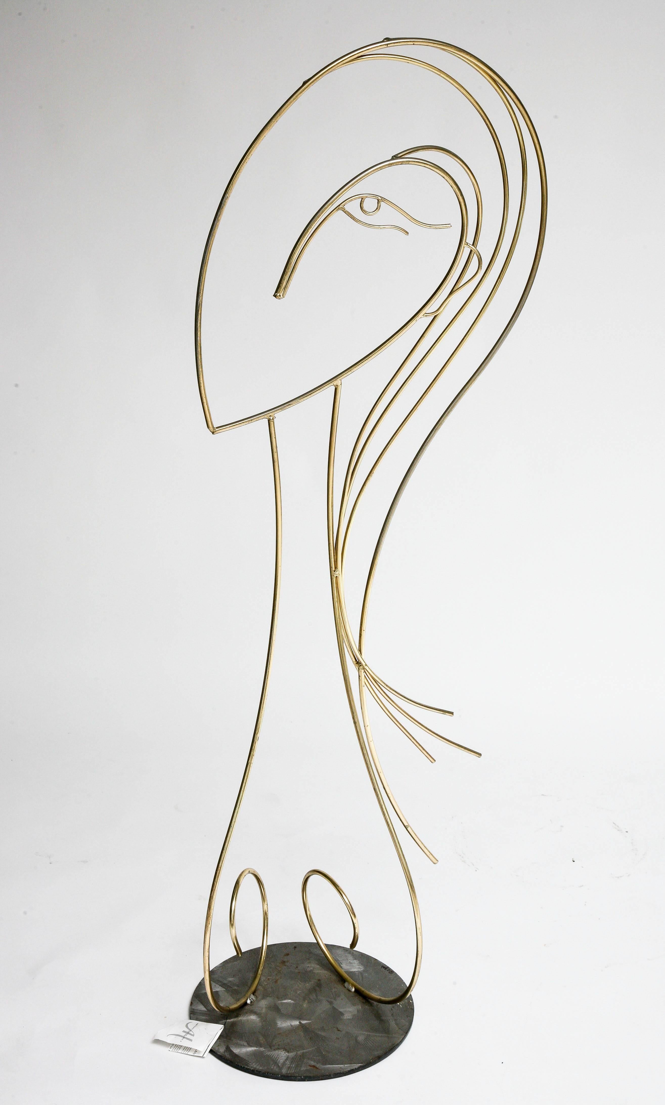 This piece dates for 1970s and was created by the iconic designer and sculpture Curtis Jere. Here he has interpreted the female face in silhouette with flowing hair and elongated neck in a brass finish which glistens as the light hits it.

This