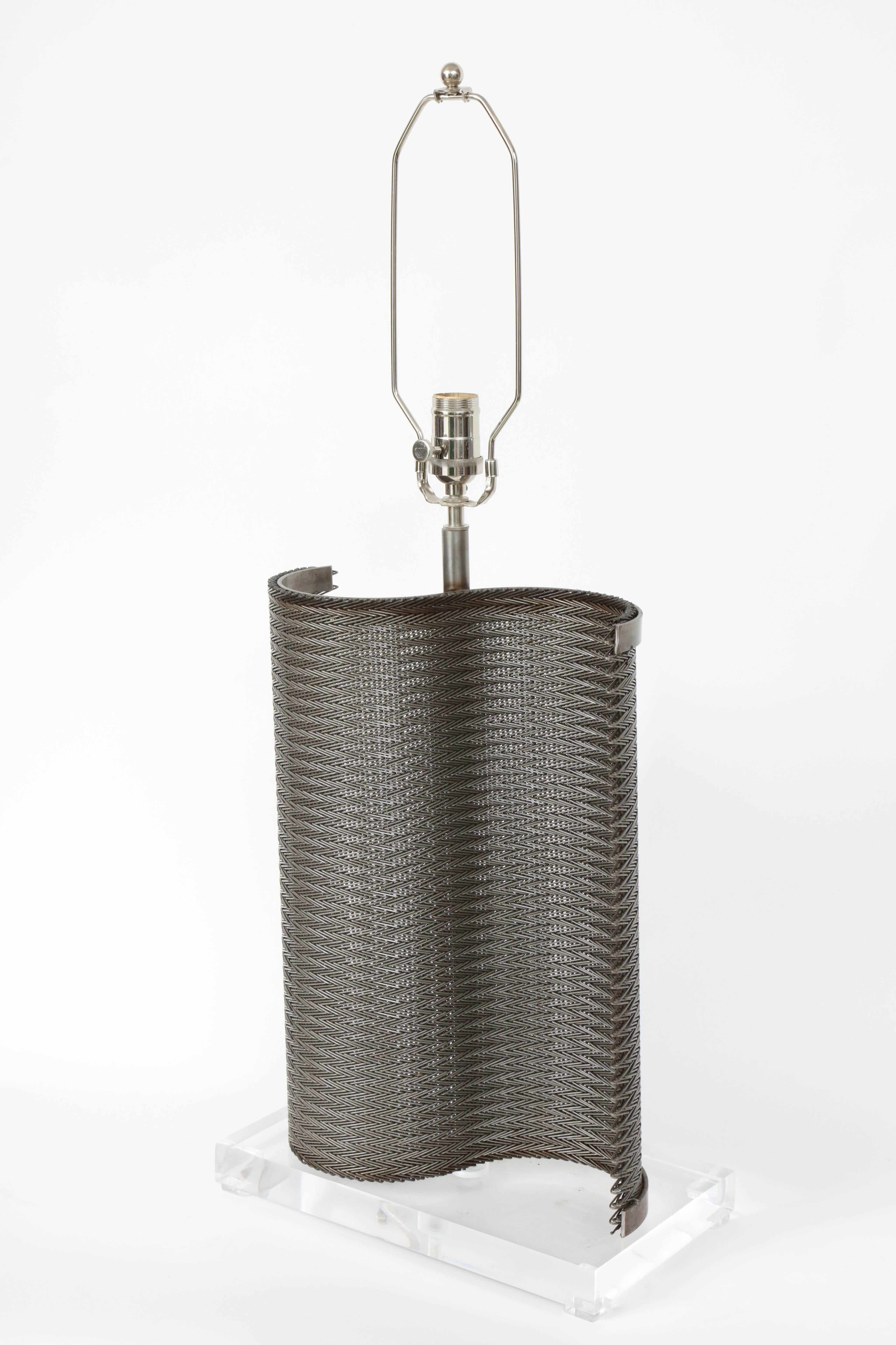 Pair of unique Industrial lamps made from repurposed steel conveyor belts in a wave pattern mounted on Lucite bases.