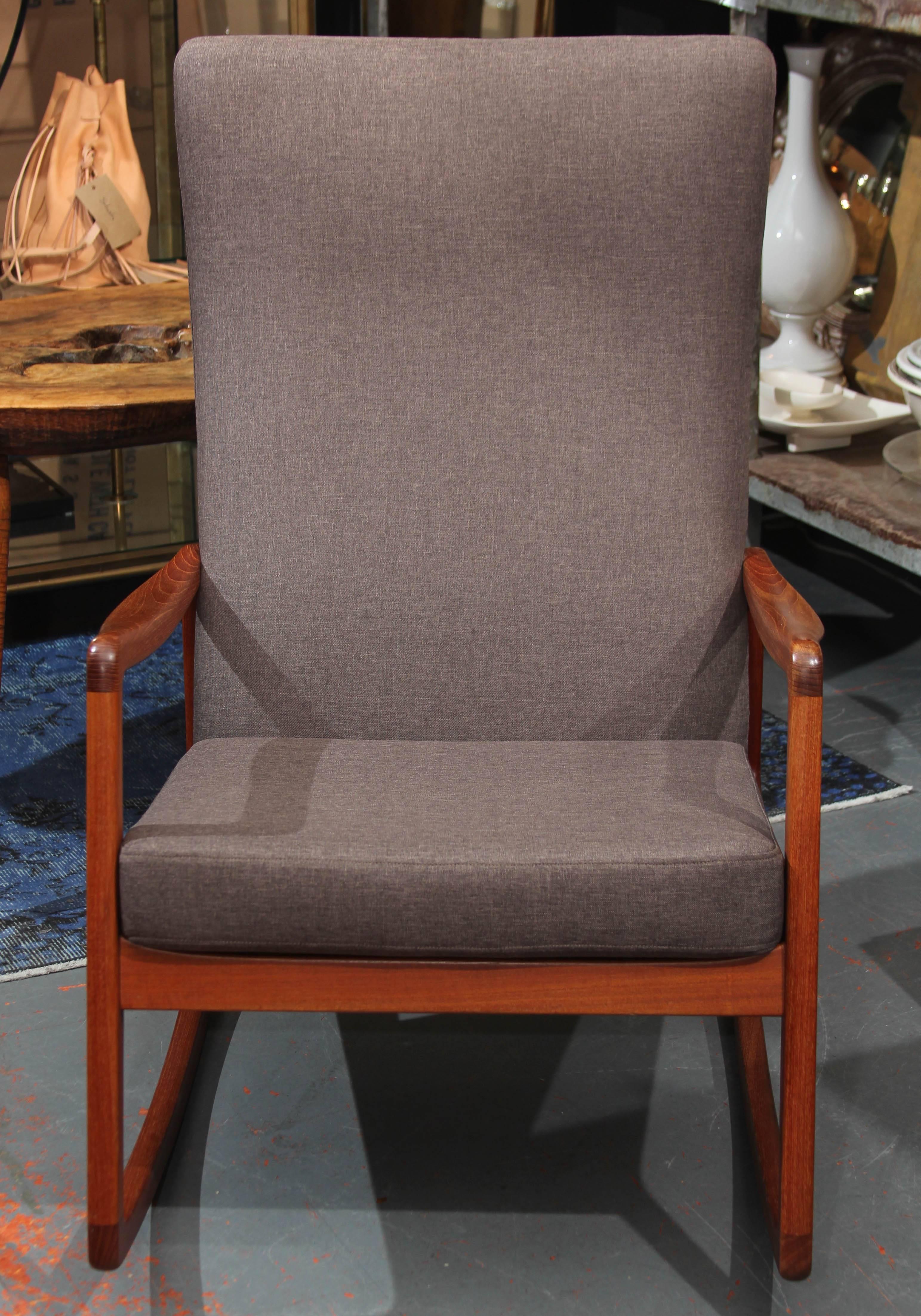 Rocker in grey linen blend upholstery.