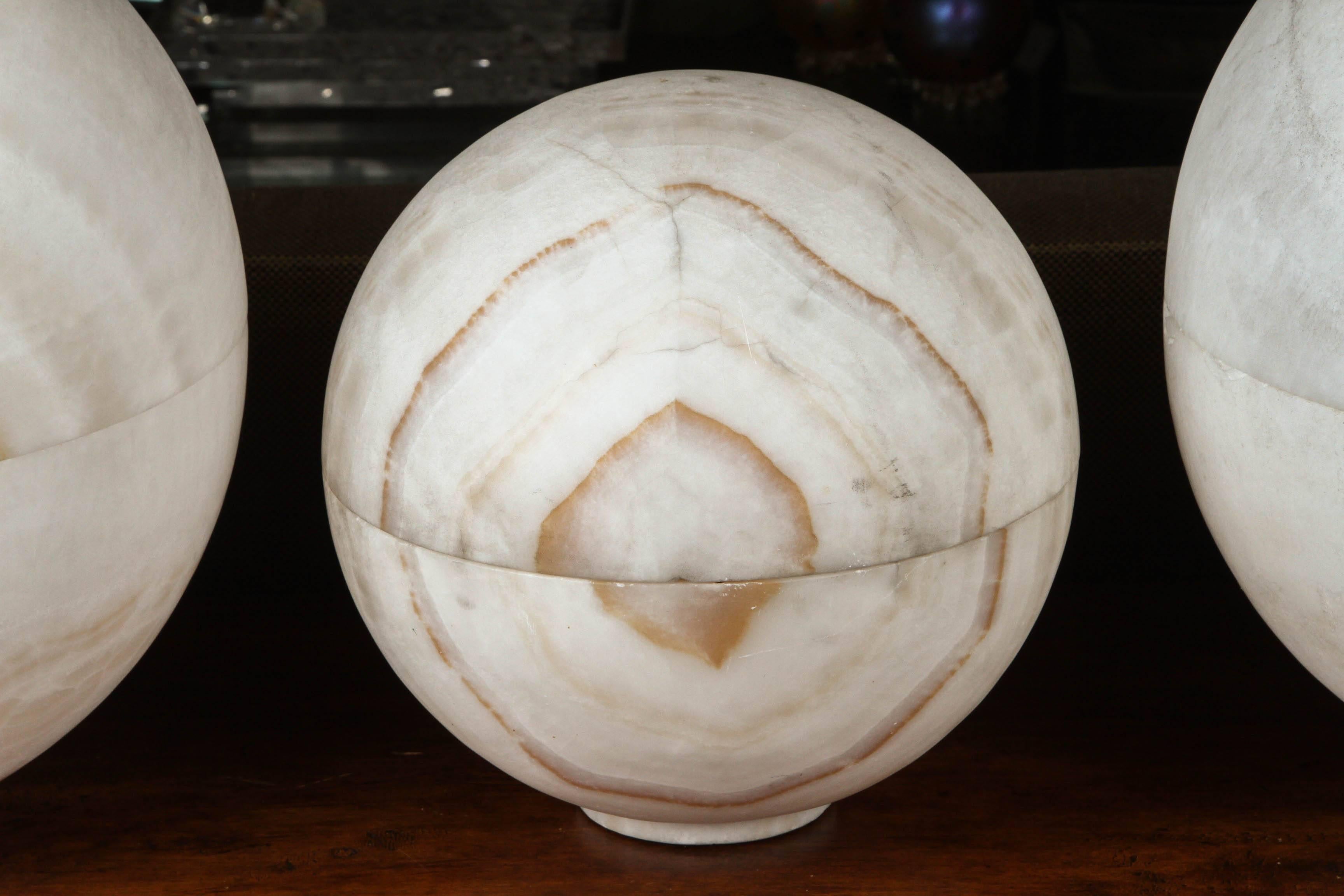 Unique carved onxy sphere lamps. Price listed is for all three, but these can be sold separately. Large spheres are 16