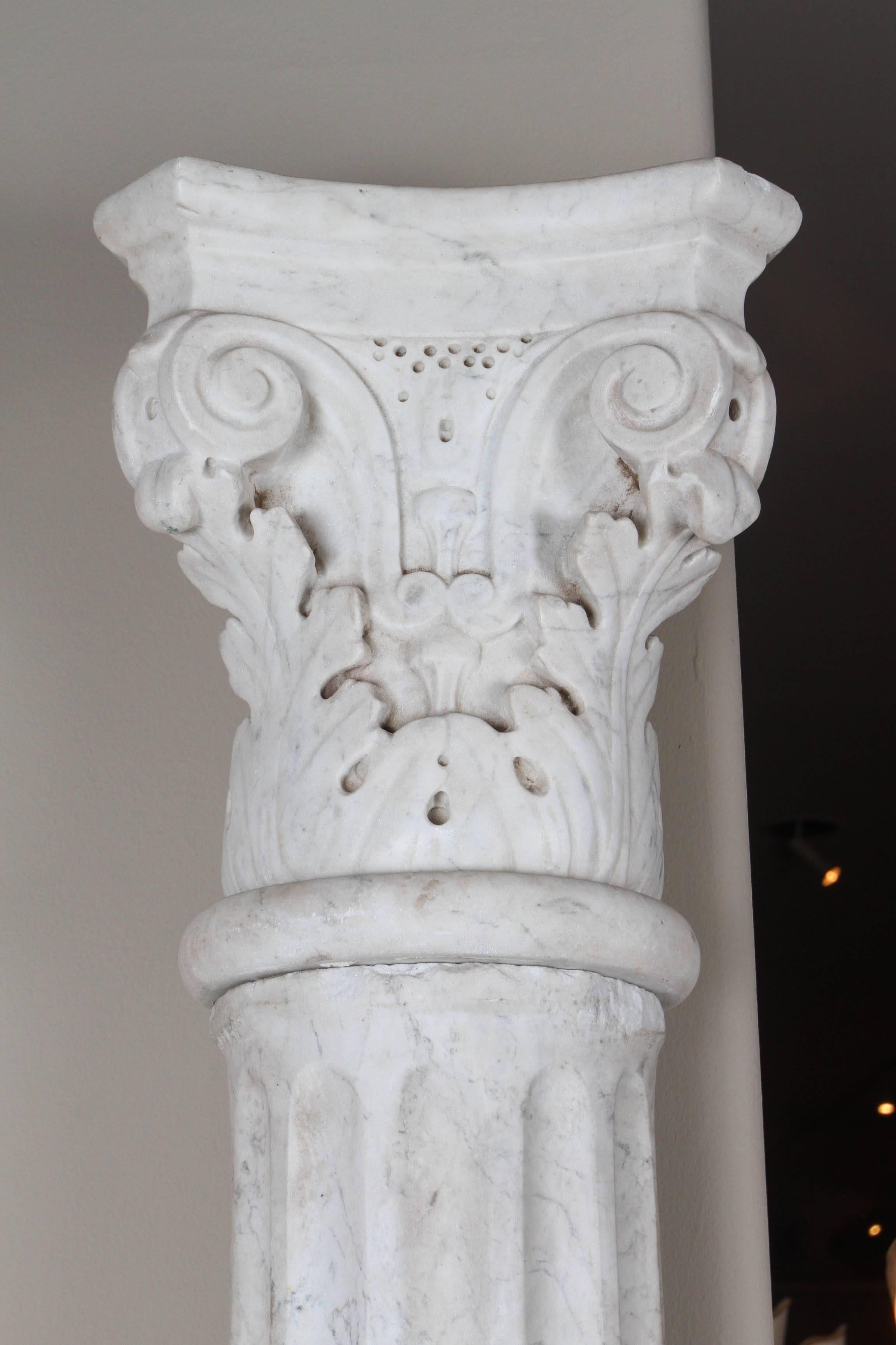 Pair of extraordinary early 19th century carved marble columns, beautifully proportioned and intricately carved. Each column is in four pieces - base, column, disc and capital.