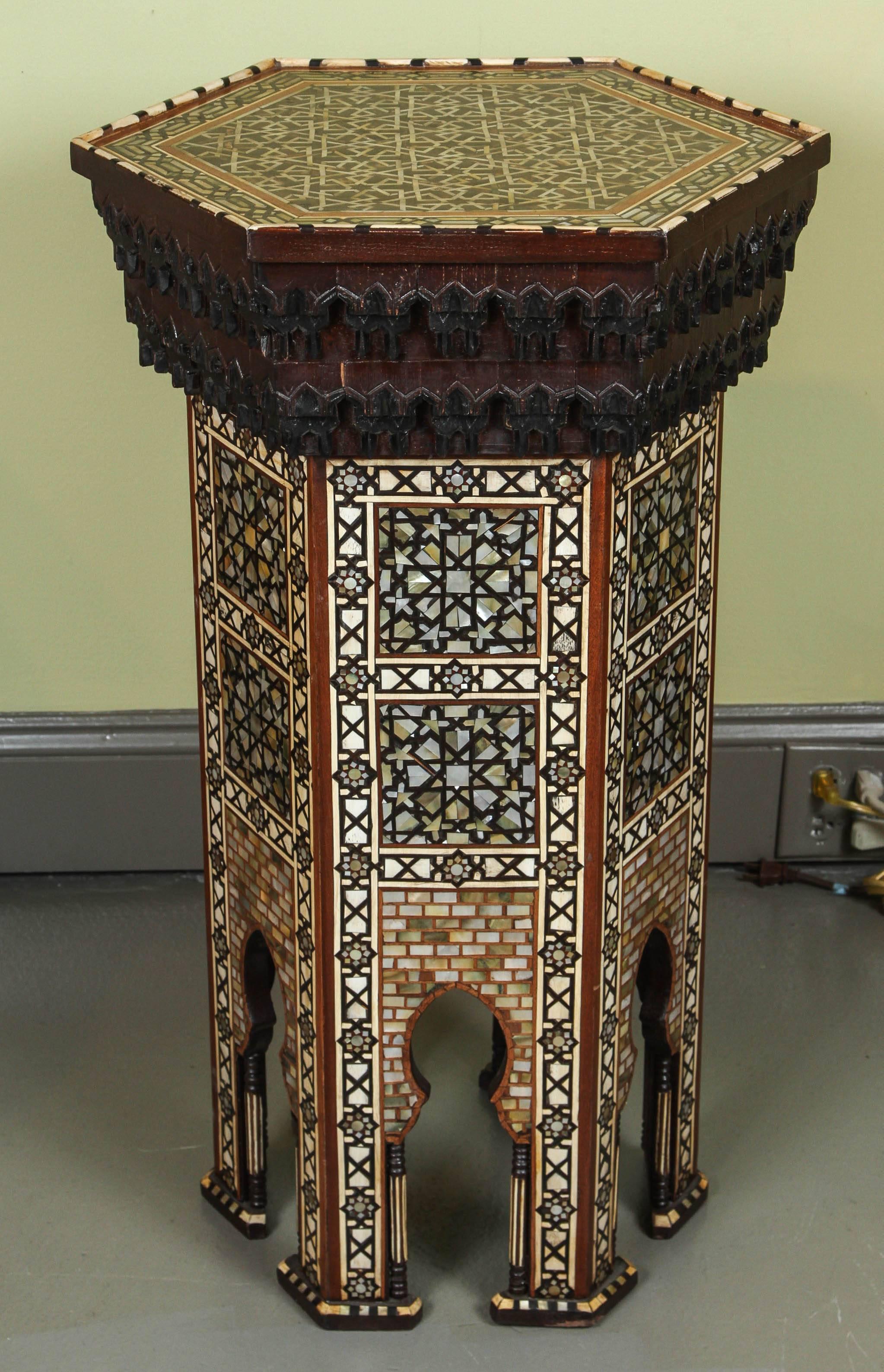 A fine pair of Moorish mother-of-pearl inlaid hexagonal stands.