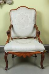 A French  Fauteuil Walnut Chair, 18th Century, newly reupholstered