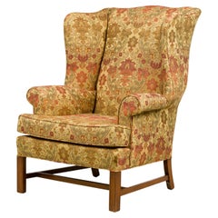 English Victorian Beige Wingback Chair With Various Colored Floral Pattern