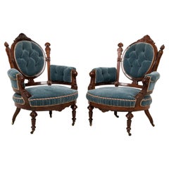 Pair of American Victorian Carved Rosewood & Tufted Powder Blue Velvet Armchairs