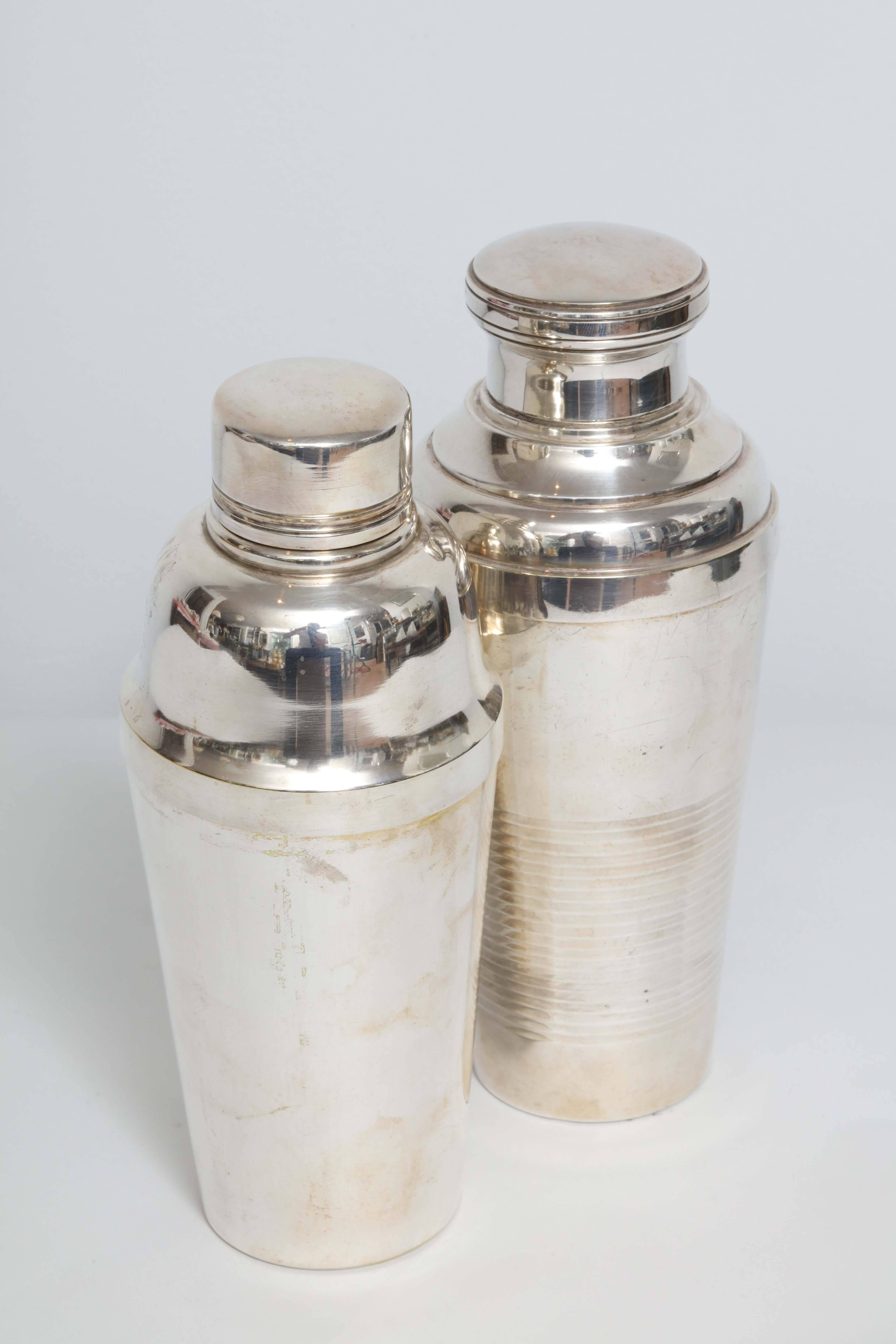 These vintage French cocktail shakers are a classic design and fine quality silver plate by the prestigious
French maker Christofle. They are complete with the slotted strainer to keep the ice from entering the drink.
A great bar necessity.