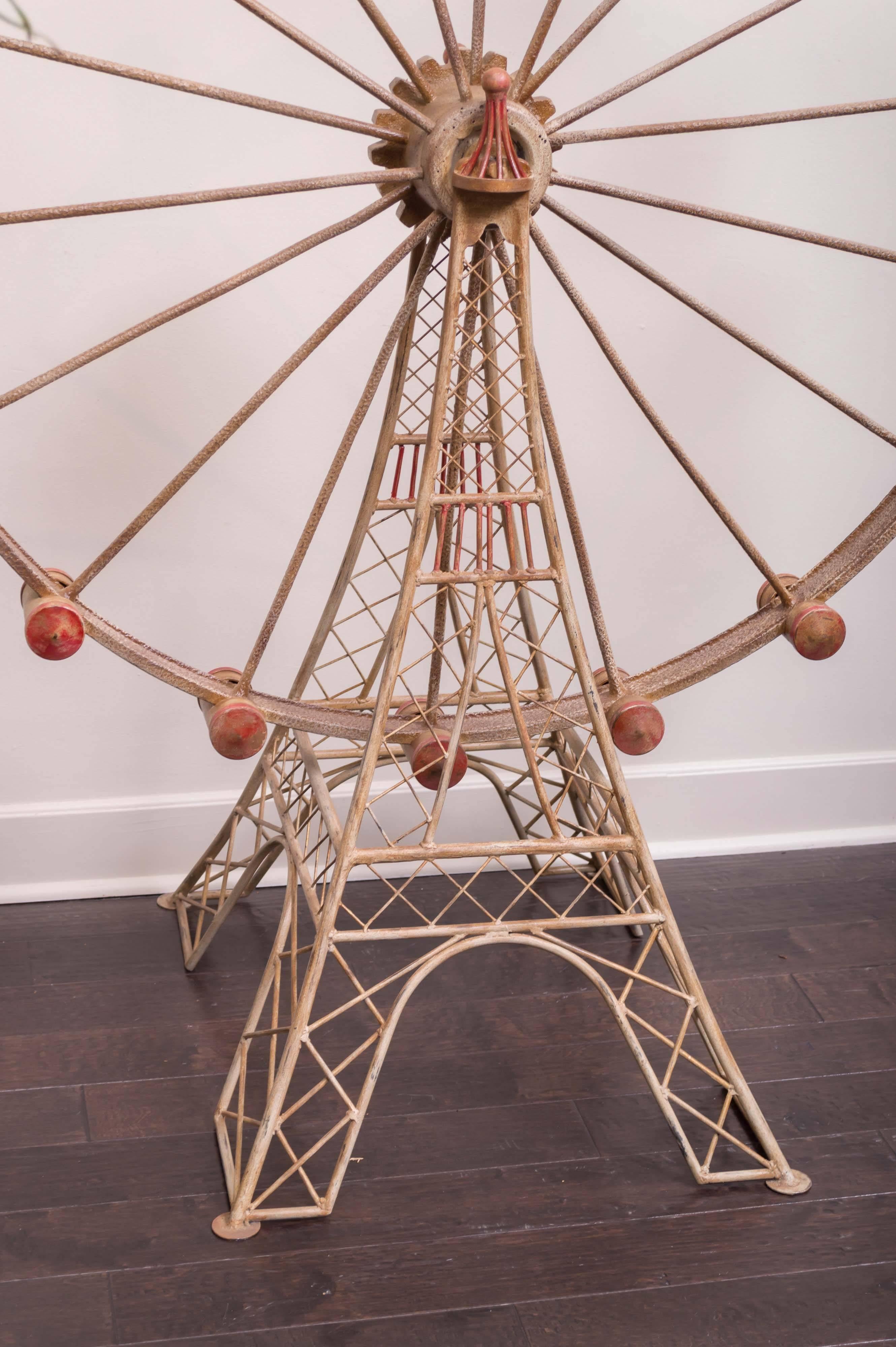 Large-scale painted metal ferris wheel model, French, circa 1920.