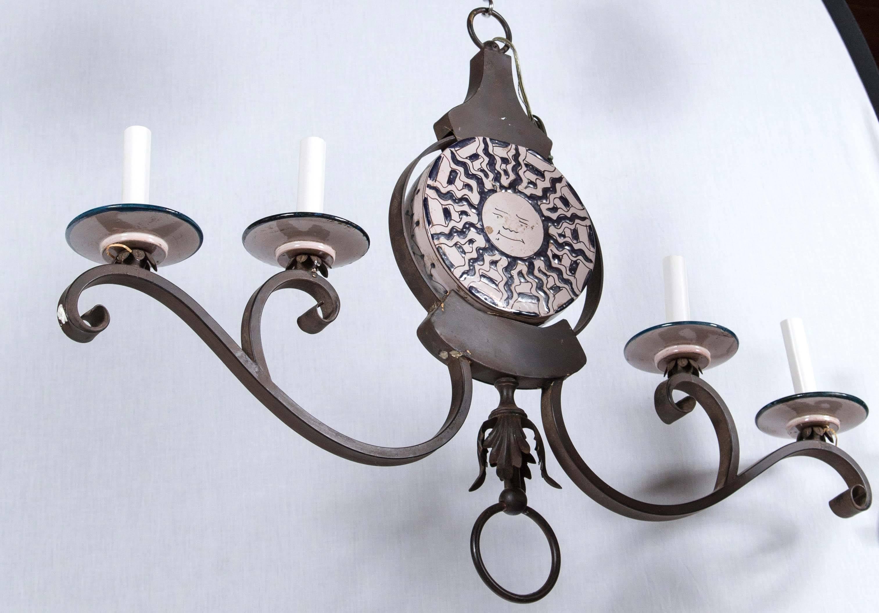Banci sun face chandelier wrought iron with four lights. New old stock.
 