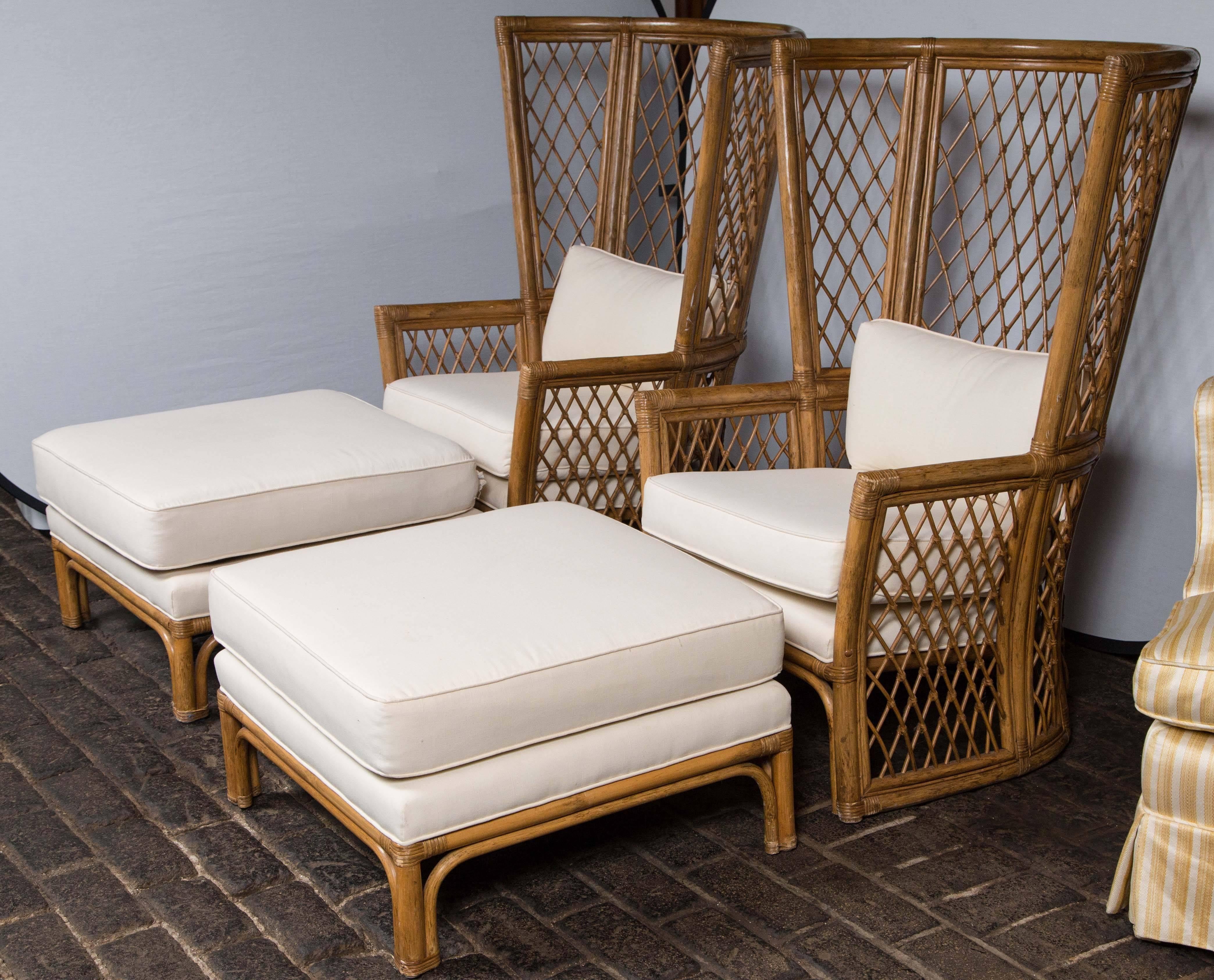 Pair of stunning highback lattice bamboo armchairs with matching ottomans. Seat height 18", arm height 23.5".
Ottomans: 26.5" sq, 16" H.
Fabric is new.
Price includes all four pieces.