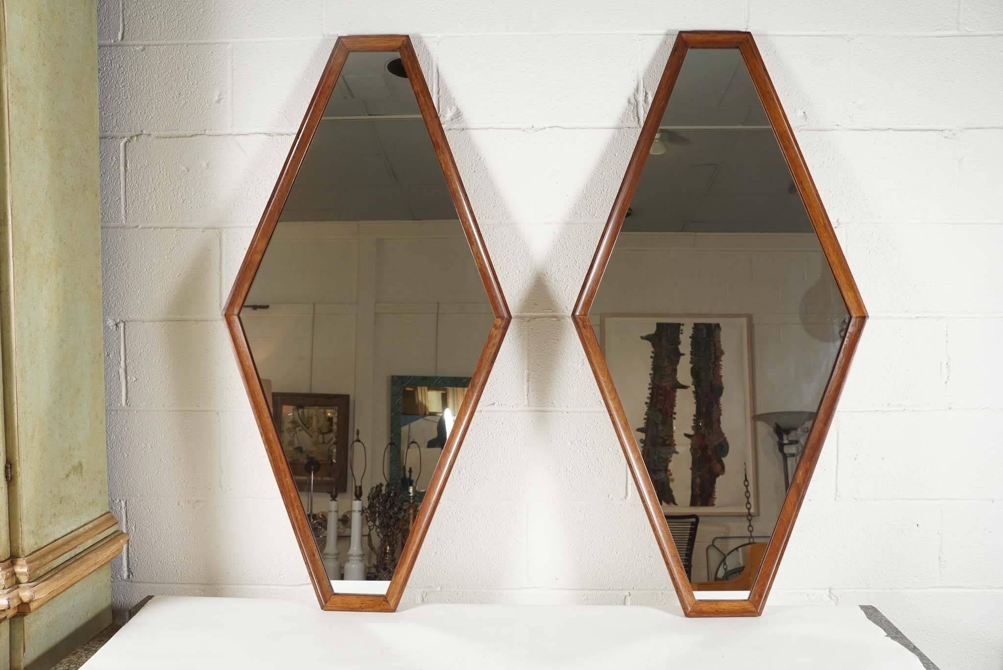 Here is a great pair of modern diamond shaped mirrors with a light walnut wood surround. The wood frame is inset with a raised edge.