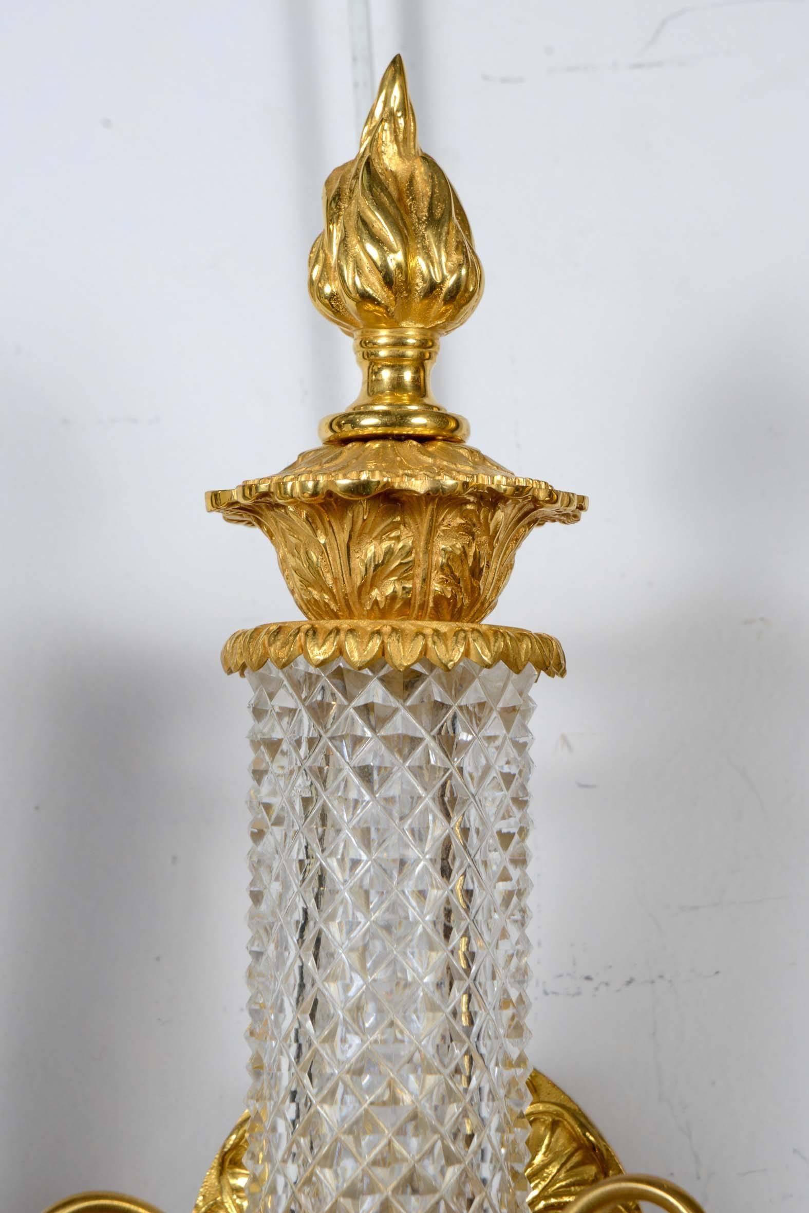 Pair of two-light sconces in Louis XVI style, gilded bronze and crystal of Baccarat.