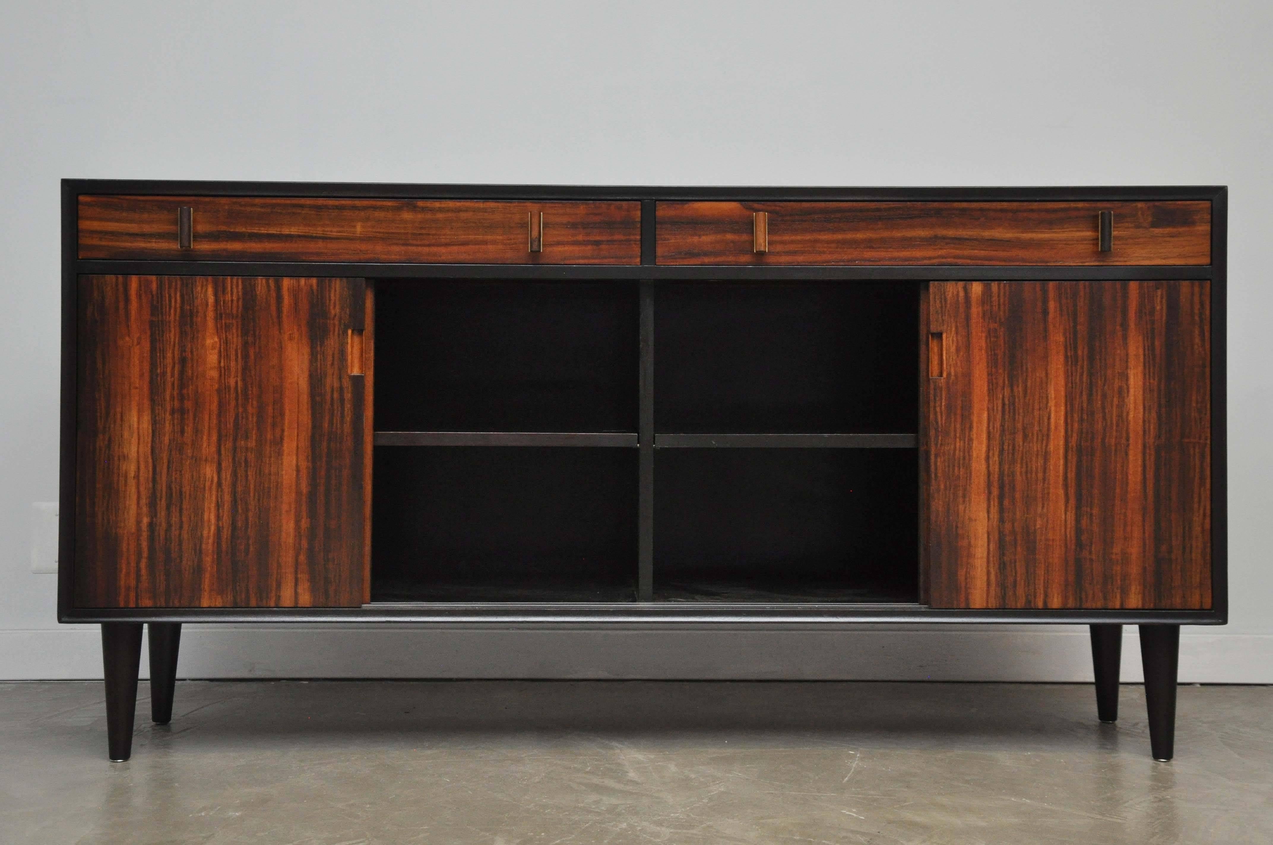 Sideboard designed by Edward Wormley for Dunbar. Model 277. Dark espresso finish case with rosewood doors and drawers. Brass and rosewood drawer pulls. Piece has been beautifully restored.