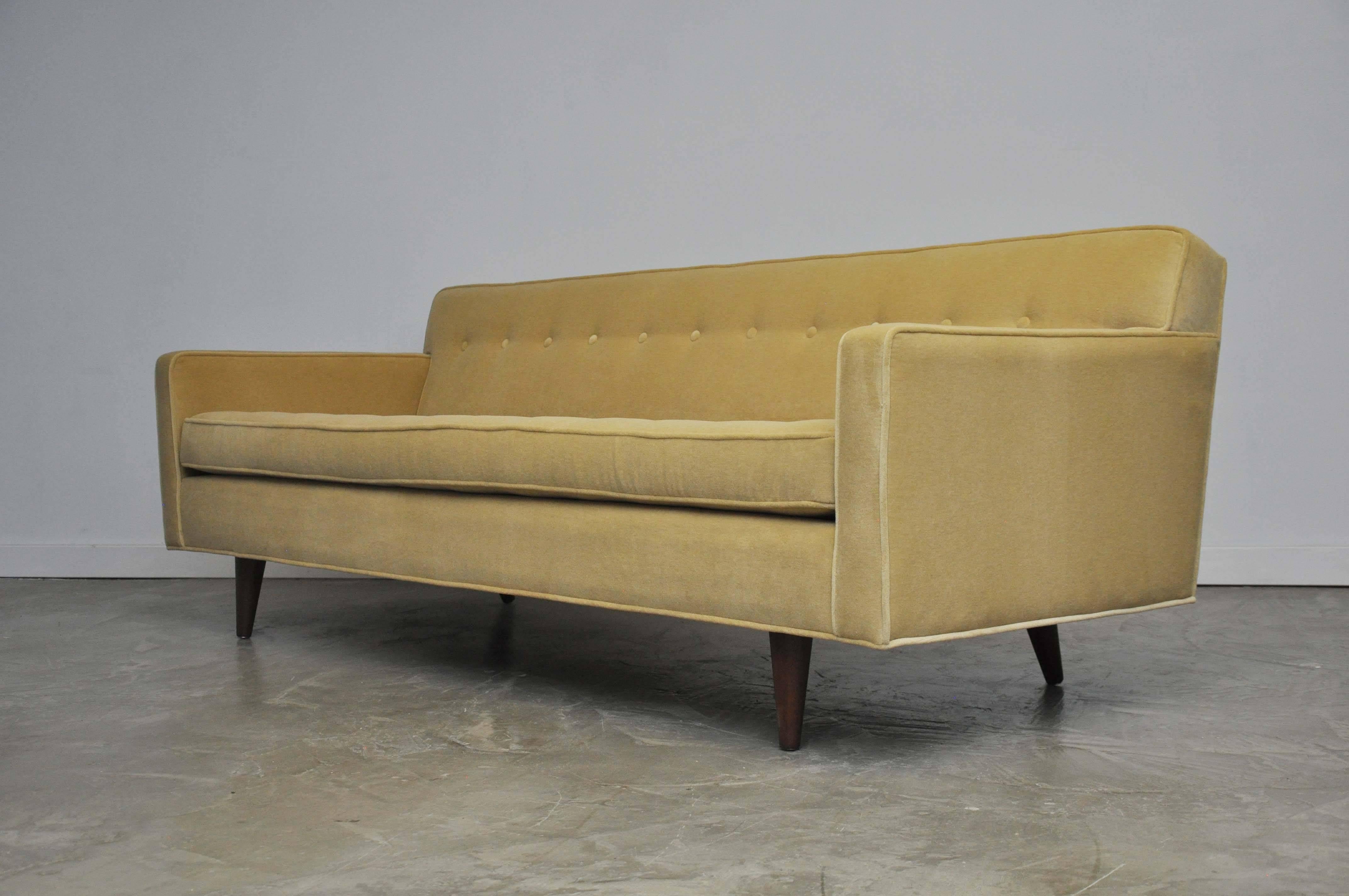 Edward Wormley designed sofa for Dunbar. Newly upholstered in Italian velvet over walnut legs.