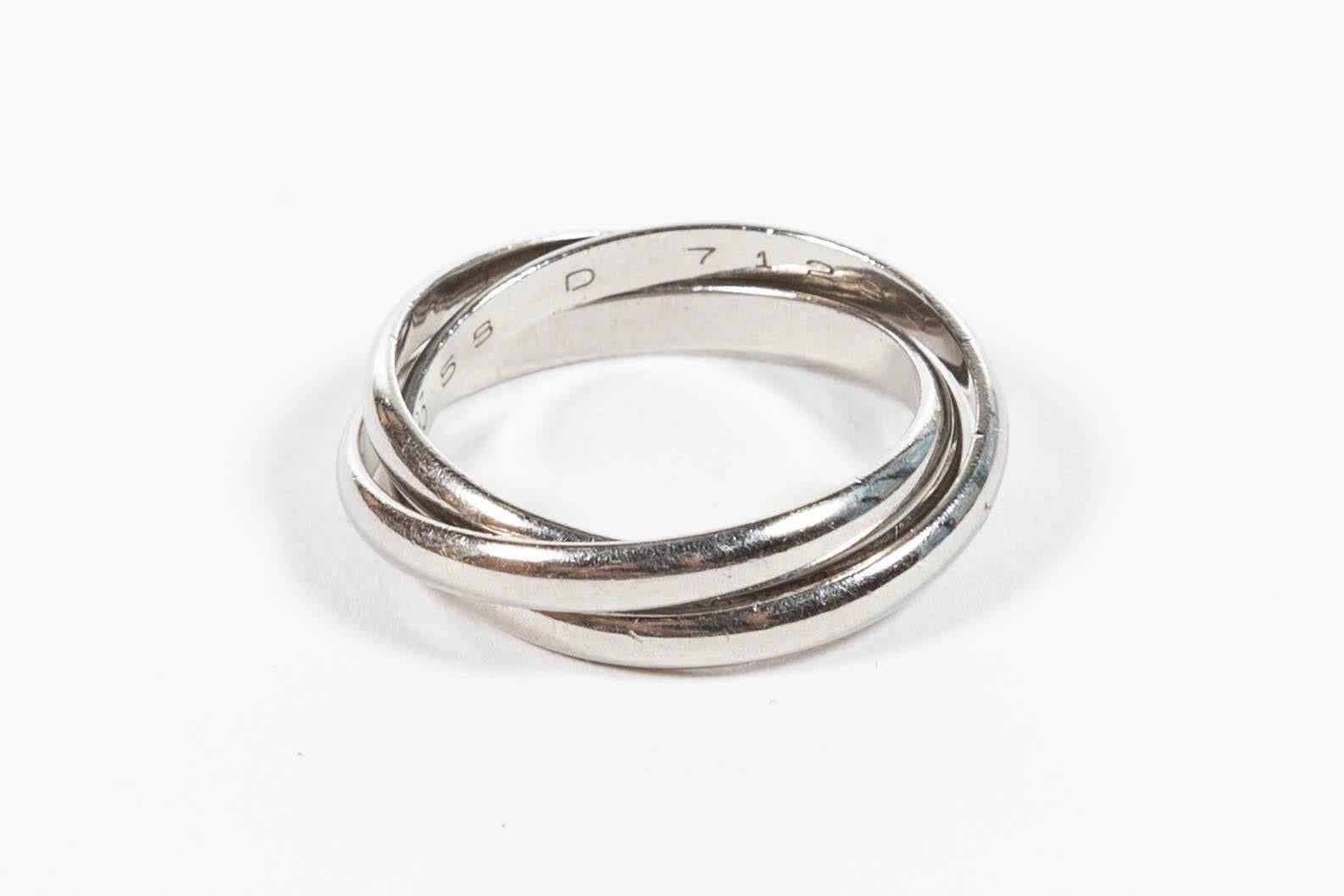 The iconic Cartier Trinity ring, Classic three-band rolling ring. All platinum (rare). Comes with Cartier box. Size 9.5.