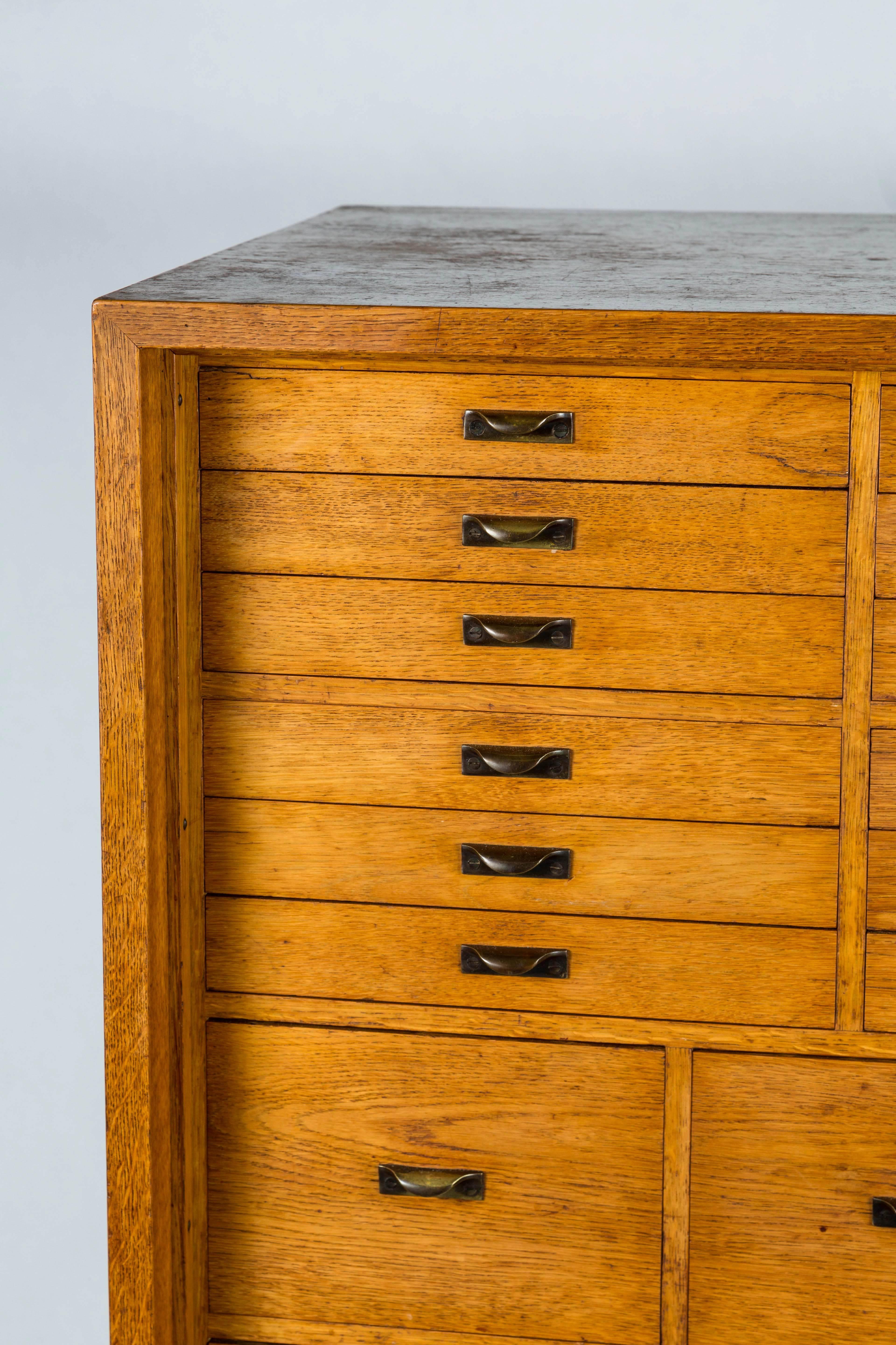 Mogens Koch Bureau, Denmark. Rare bureau with writing top/architect's cabinet. Oak with all original hardware in brass. Fully fitted with drawers of various sizes, drop down desk front fitted with original patinated leather. 

Designed in 1934,