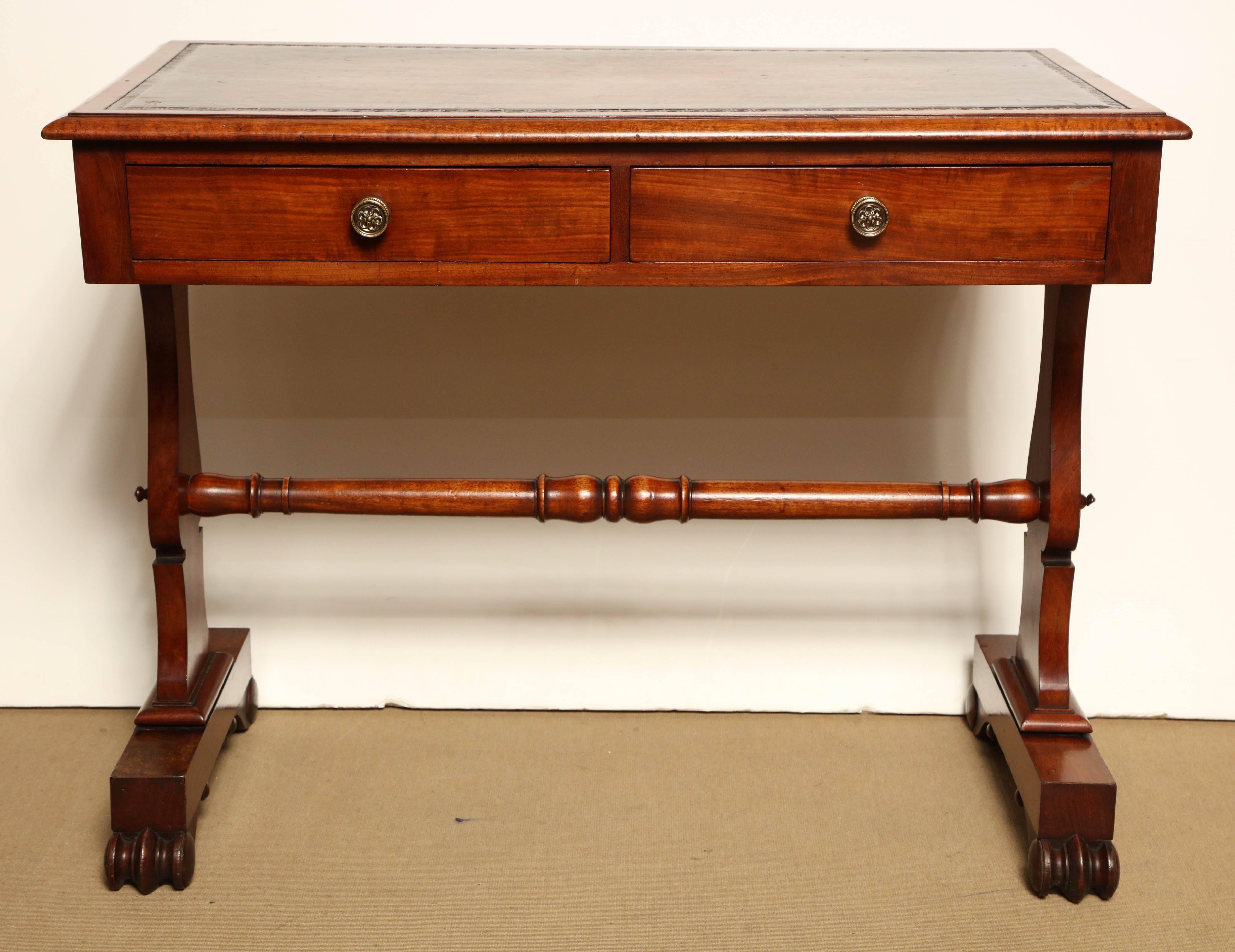 Mid-19th century English, mahogany and leather top desk.