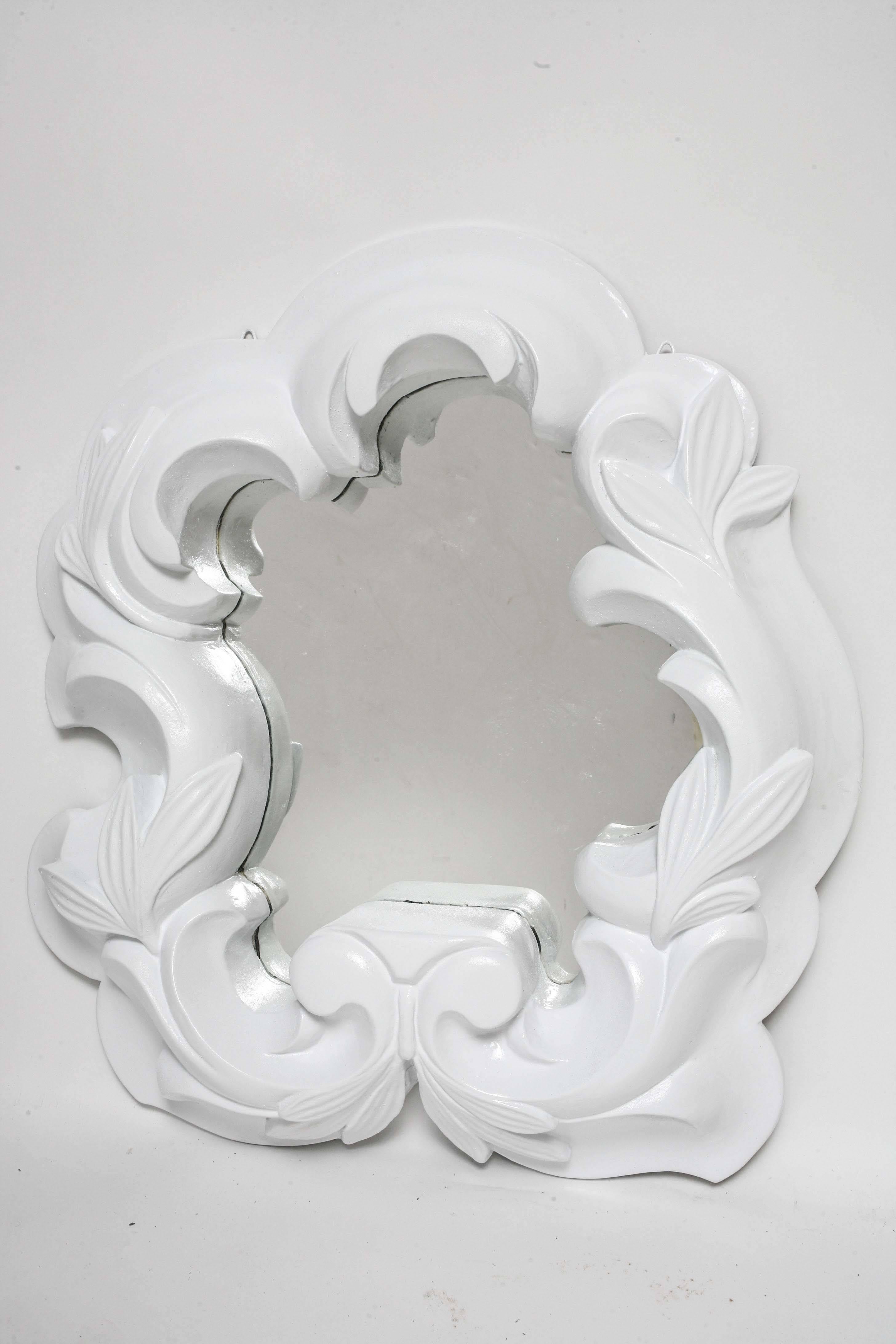 Made of plaster with painted finish, this mirror epitomizes that glam look. Mirror has been replaced, so no age spots.