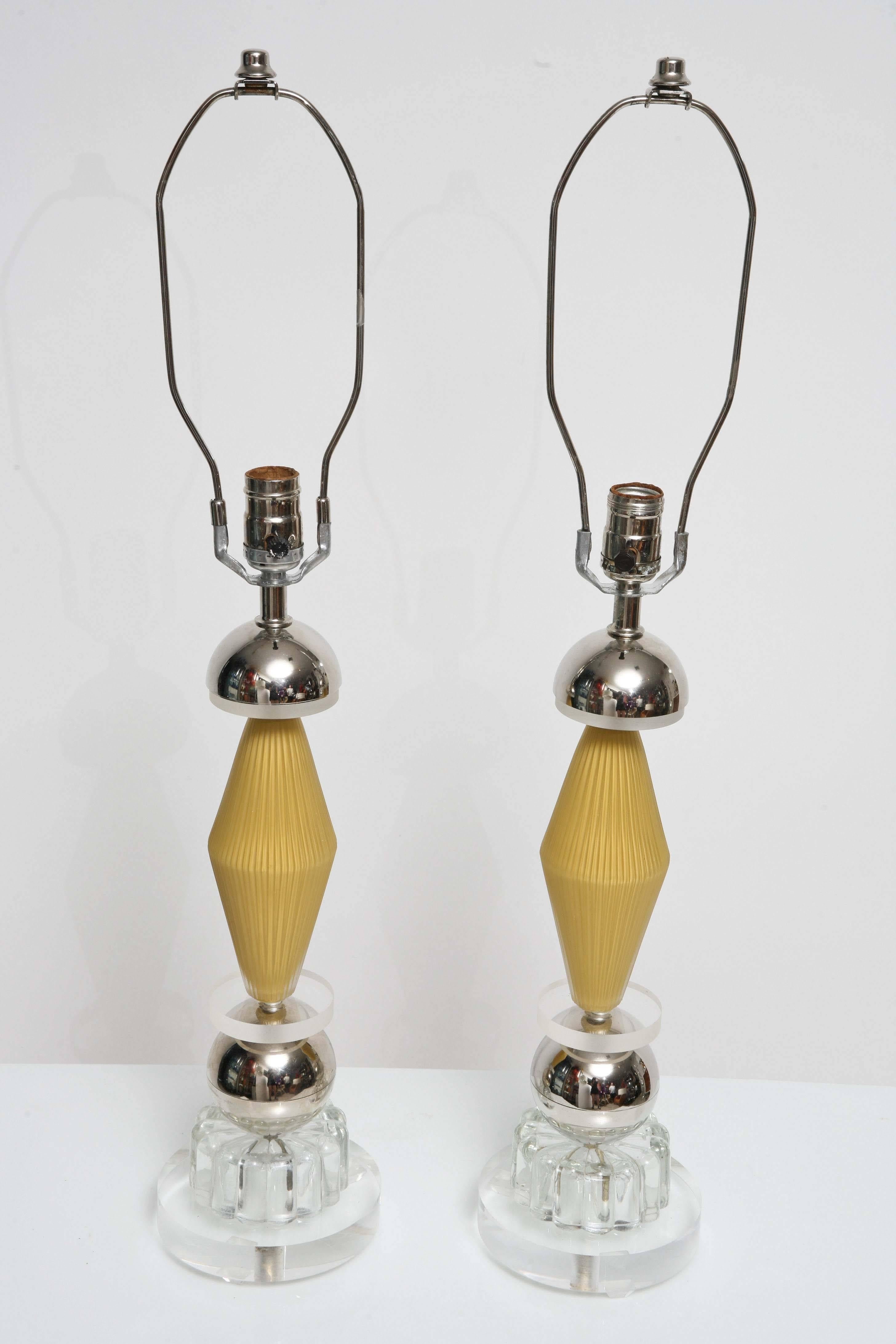 These lamps have a very unique look, though vintage they have a very post modern, Memphis look. Made of glass / Lucite / chrome, these lamps will definitely make a statement. Wiring is original and in working order. Lamps are in very good condition.