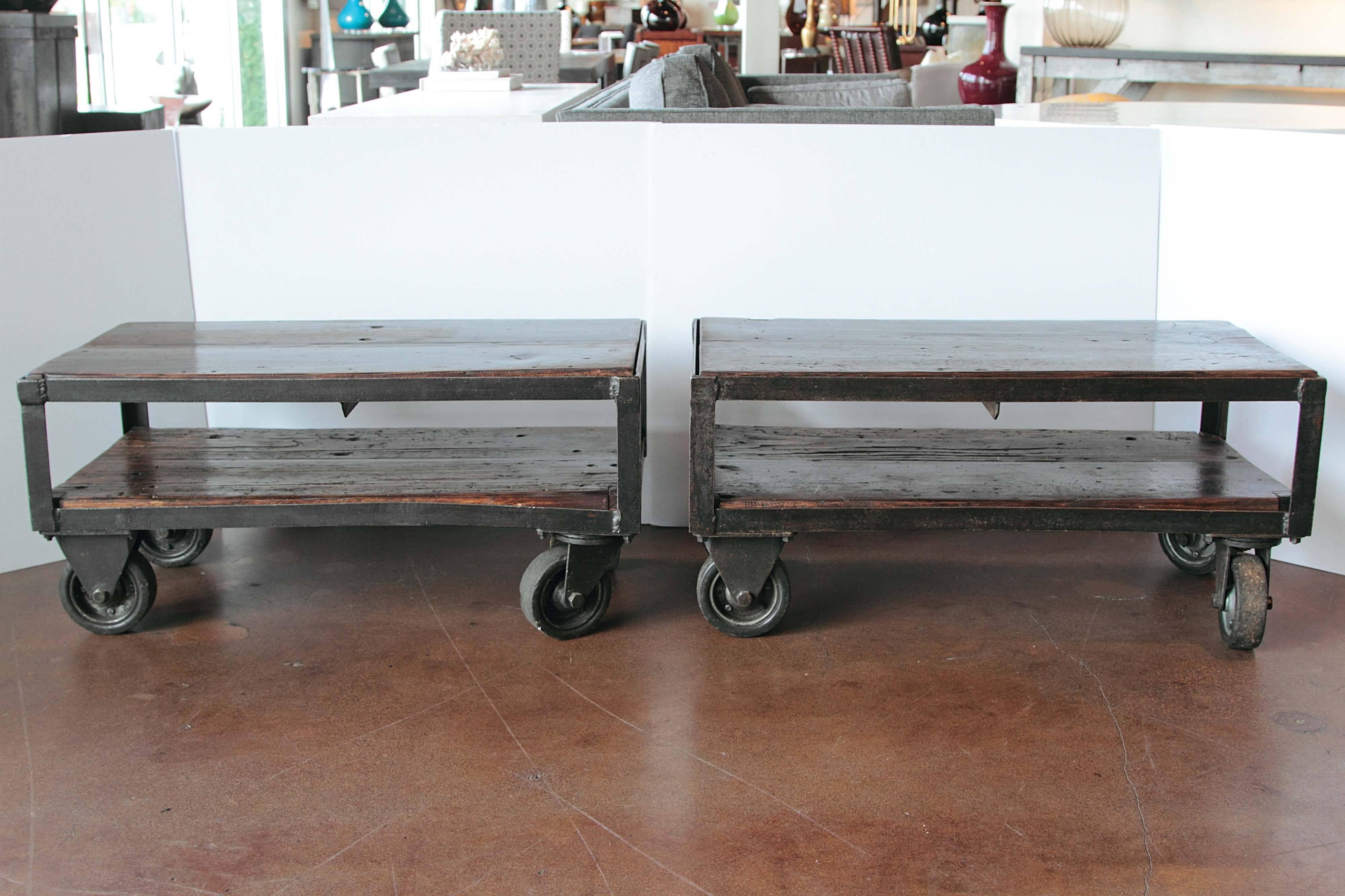 Industrial French factory cart table, circa 1940s.
Dark brown pine with iron base.
360 degree Industrial caster wheels attached to bottom.
Inner cart storage space. Inner cart measurement: 7