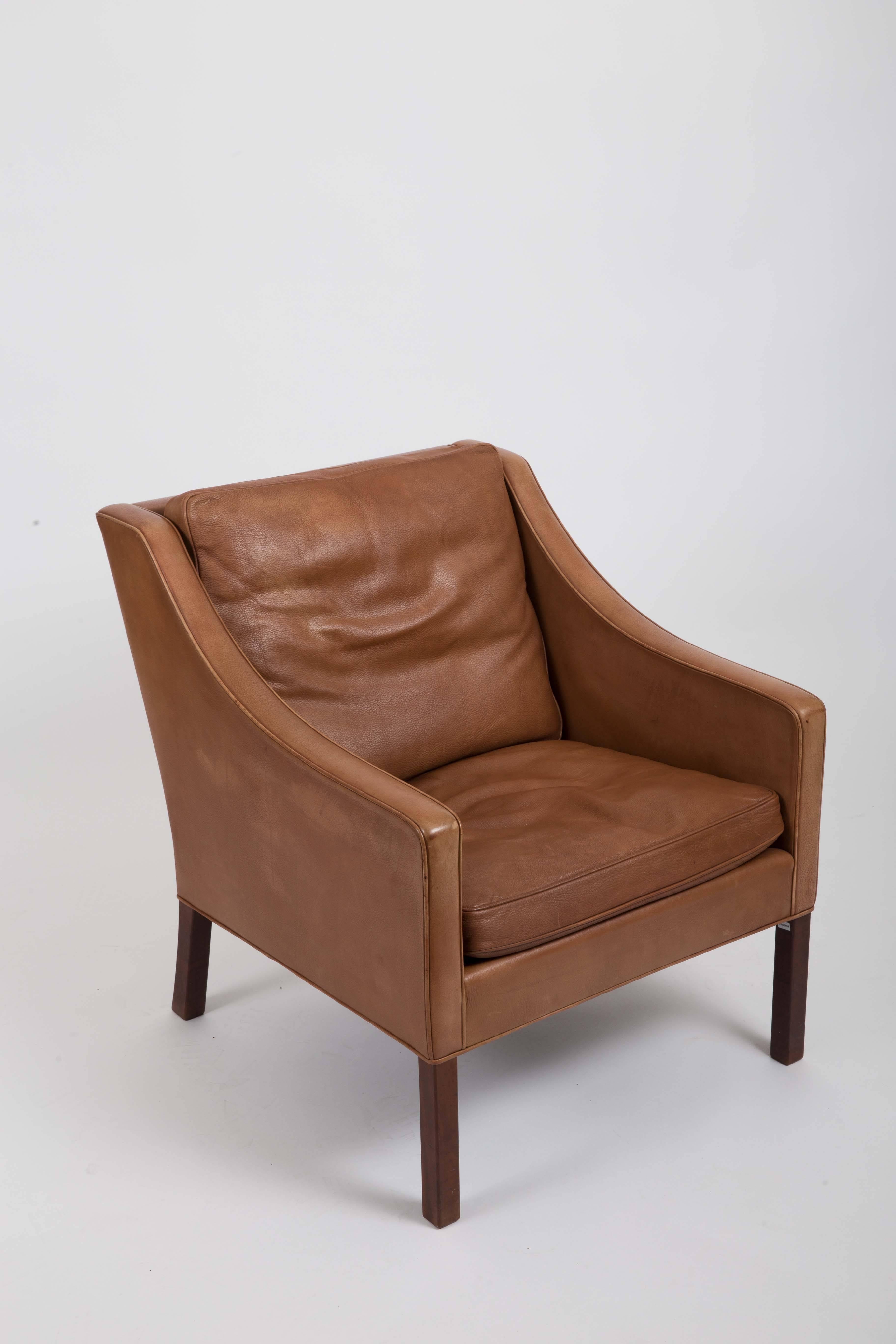 Brown leather armchairs by Børge Mogensen.