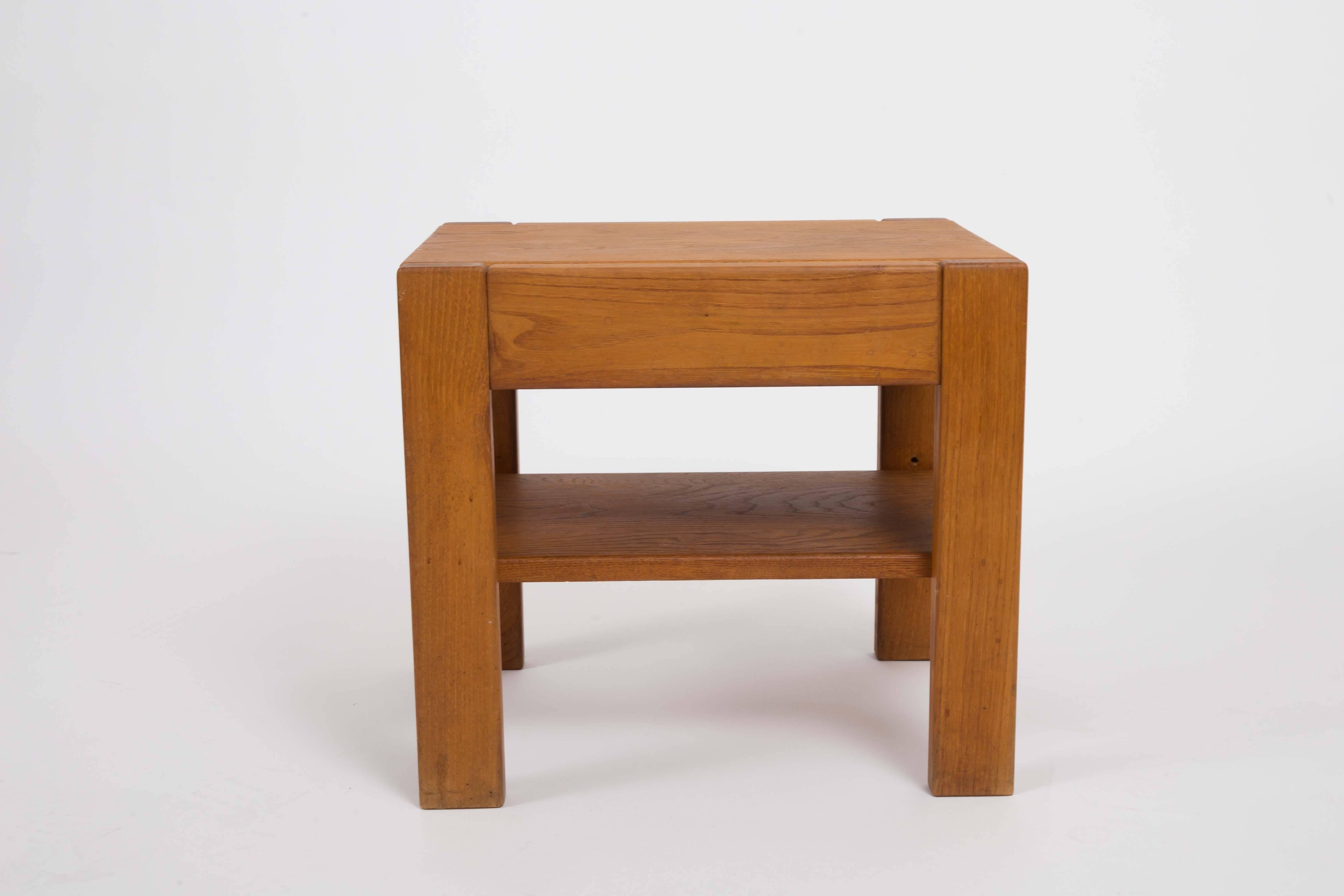 Wooden side table with adjustable lower shelf.