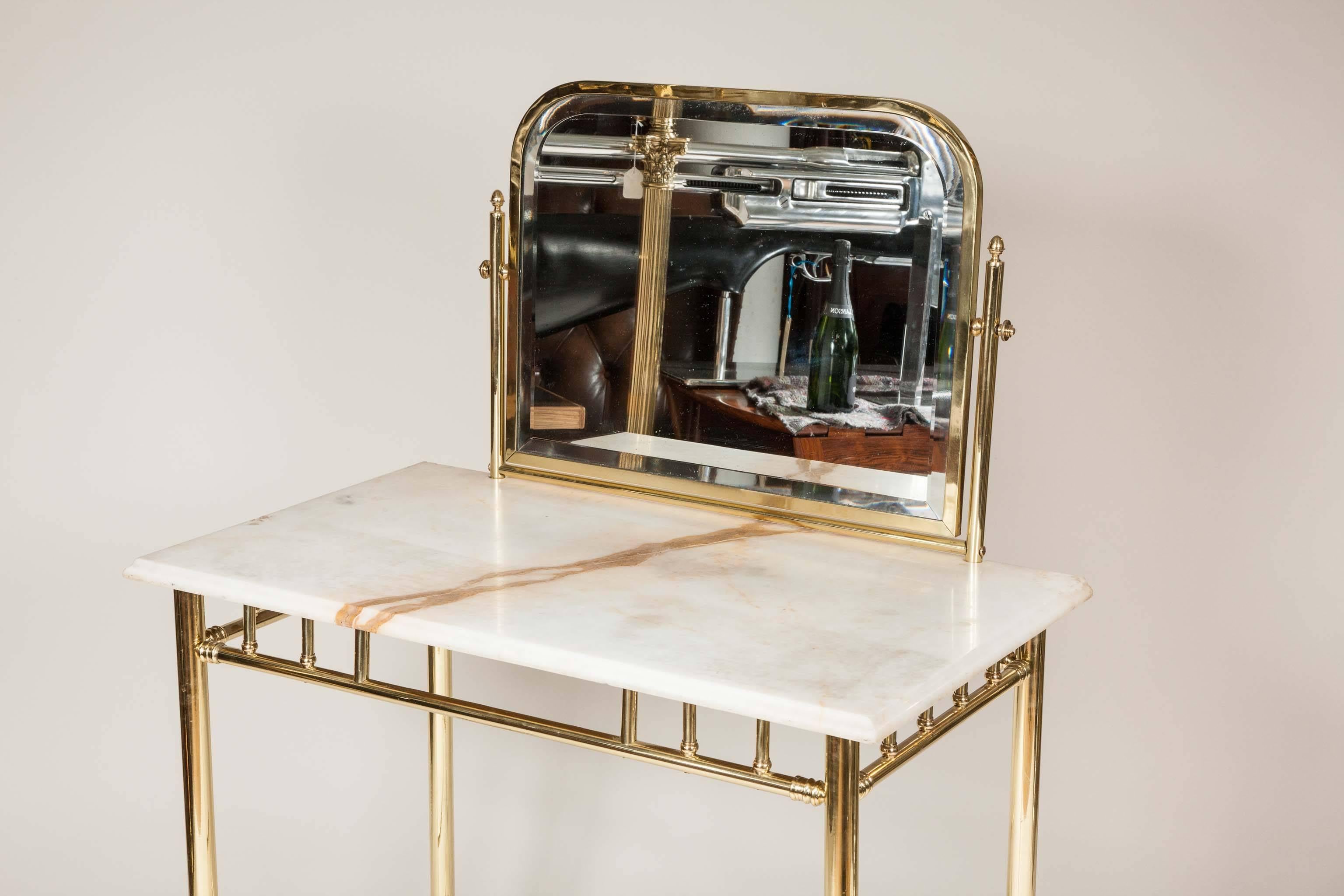 20th Century An Edwardian brass dressing table with marble top, circa 1910.