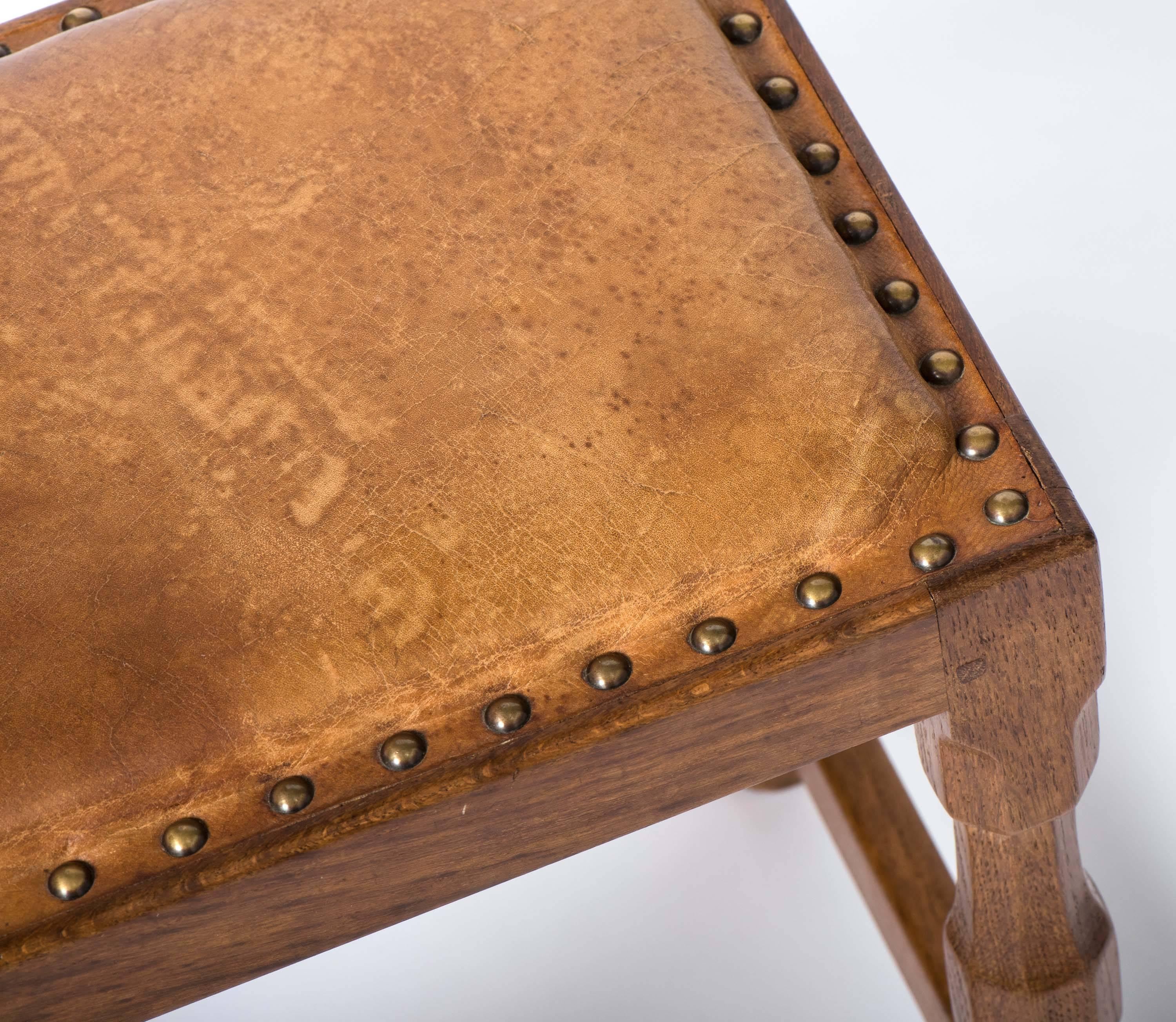 A Sid Pollard oak stool.
The rectangular top set with a leather cover.
On octagonal shaped supports.
English,
circa 1950.
Measures: 42 cm high x 35.8 cm wide x 28 cm deep.
 