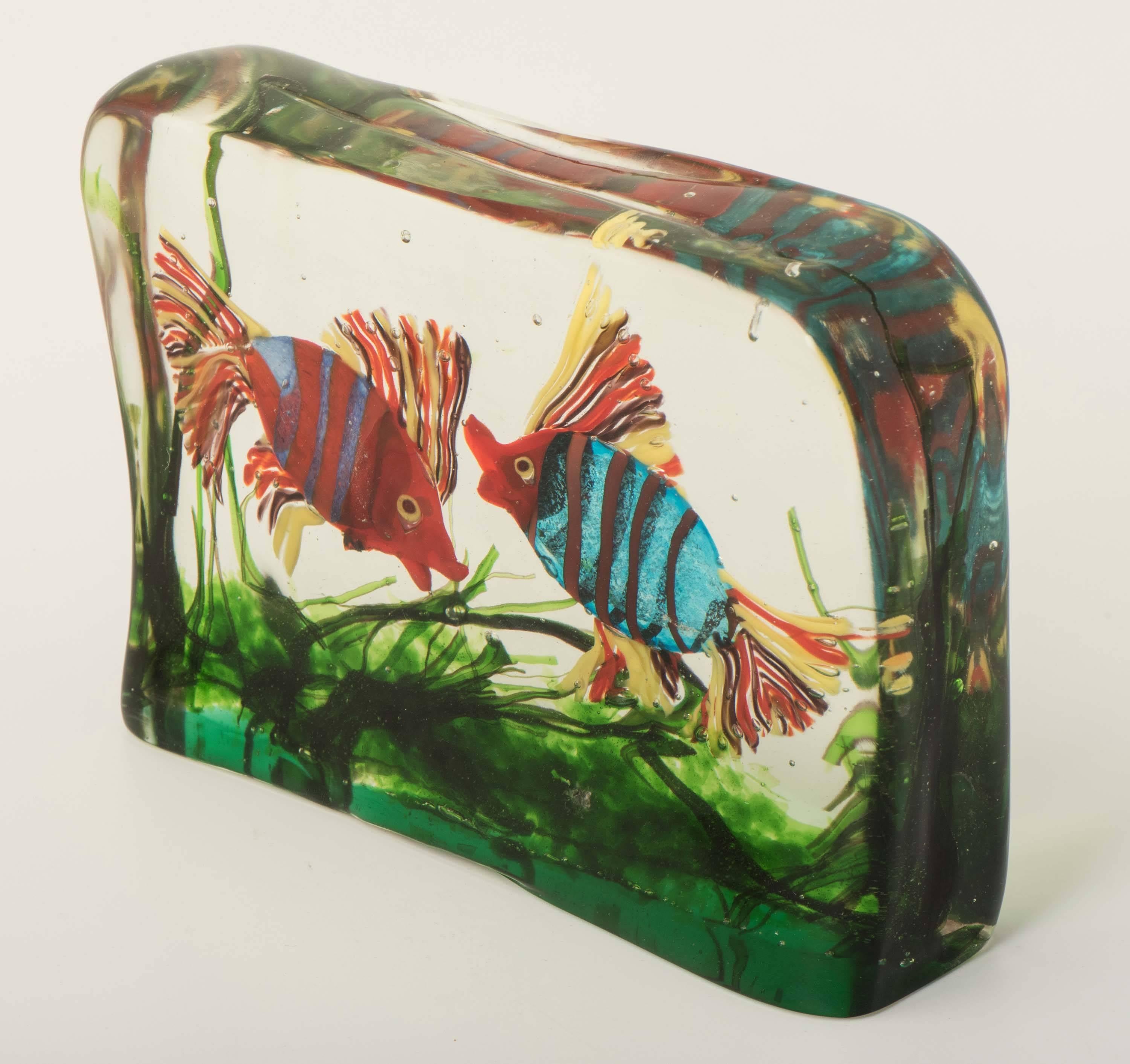 A large Murano glass aquarium by Gino Cenedese.
Design attributed to Riccardo Licata.
Three dimensional water scene created from three colorless glass panels with polychrome fish and grasses,
Italy, circa 1950.
Measures: 16.6 cm high x 23 cm