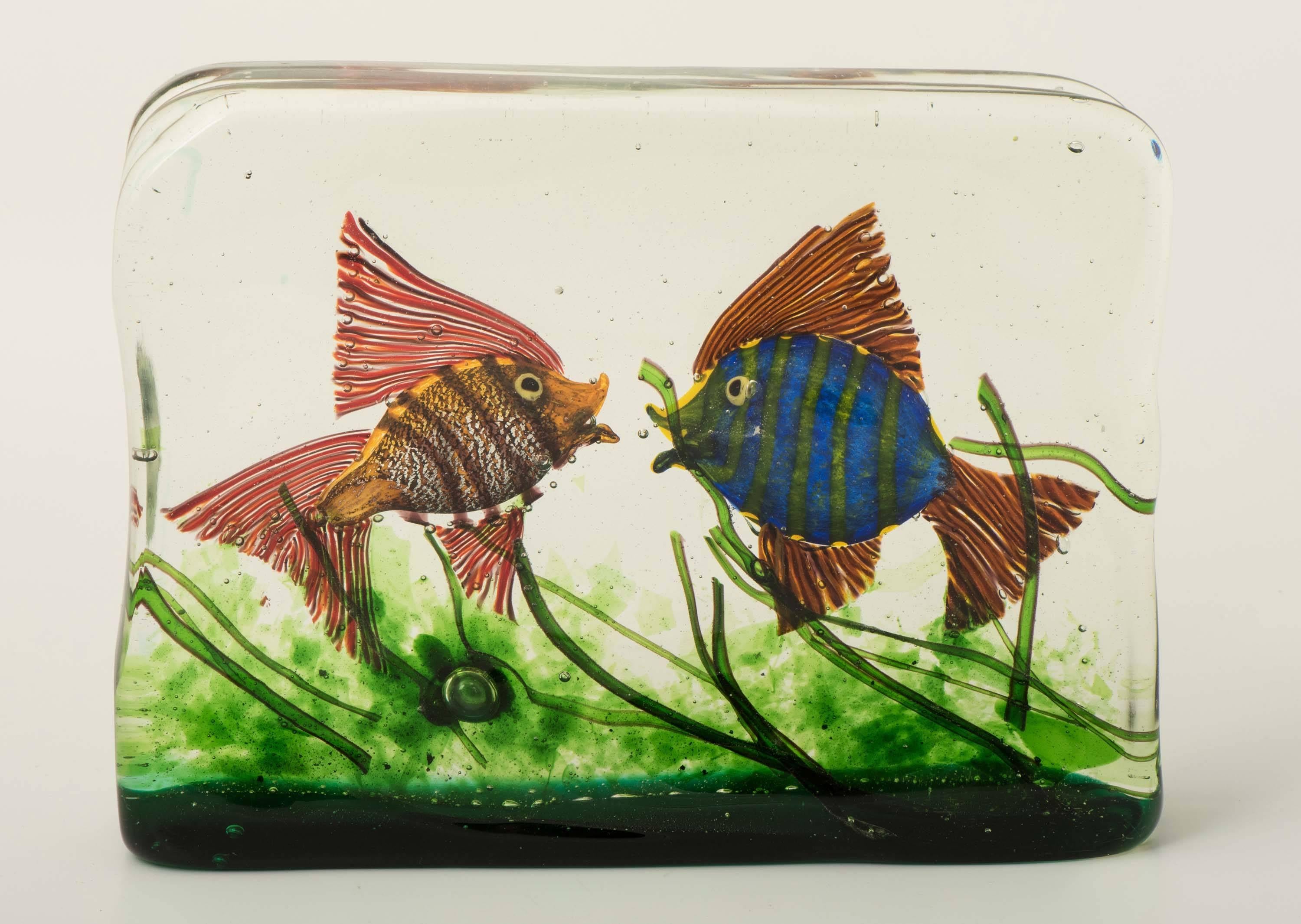 A large Murano glass aquarium by Gino Cenedese.
Design attributed to Riccardo Licata.
Three dimensional water scene created from three colorless glass panels with polychrome fish and grasses,
Italy, circa 1950.
Measures: 16.6 cm high x 23 cm