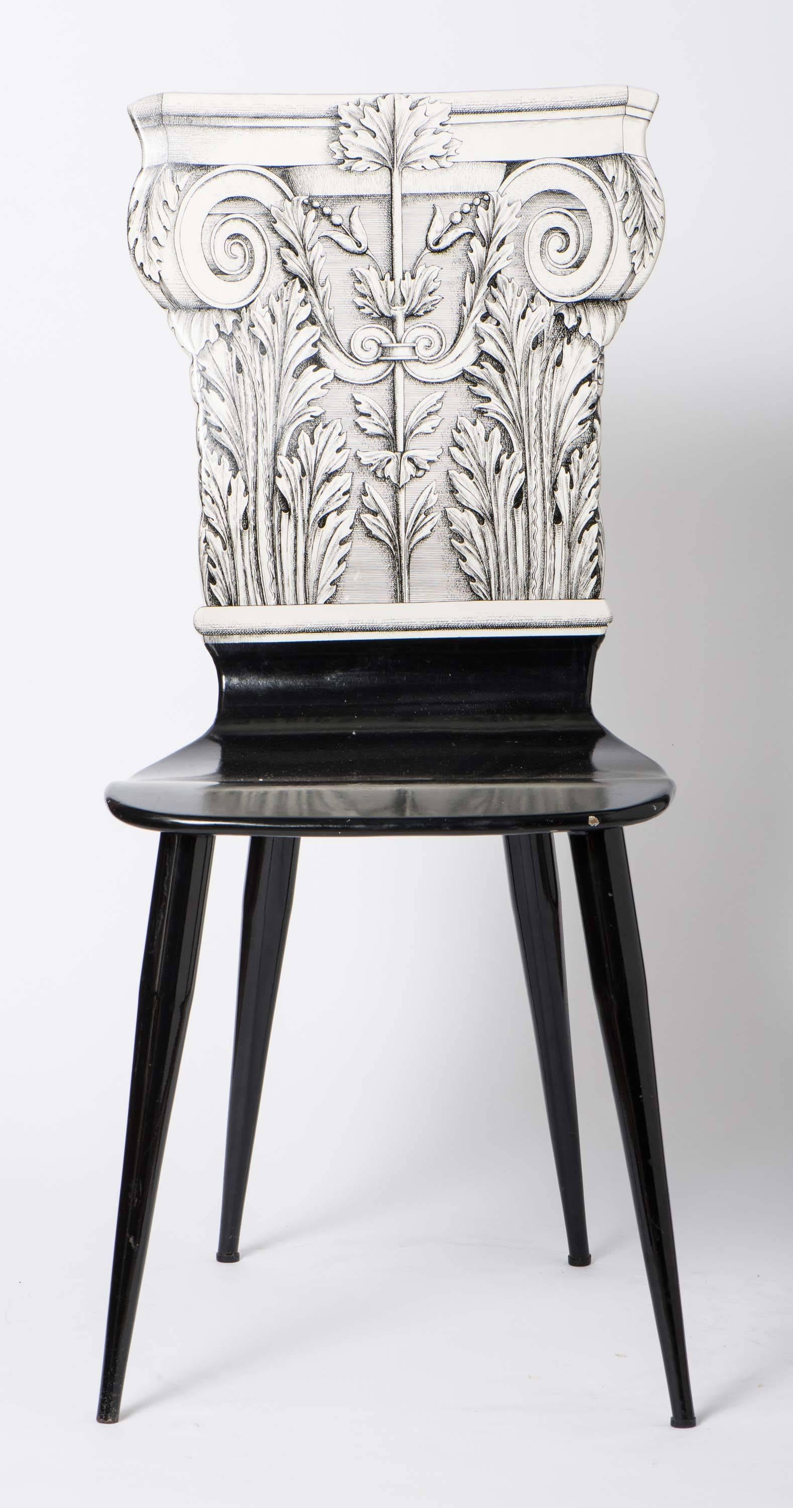 An early chair by Piero Fornasetti.
“Capitello Corinizio”
Lithographically printed.
Wood, lacquer and metal legs and base.
Italy, circa 1960.
Measures: 94 cm high x 41 cm wide x 45 cm deep.
 
