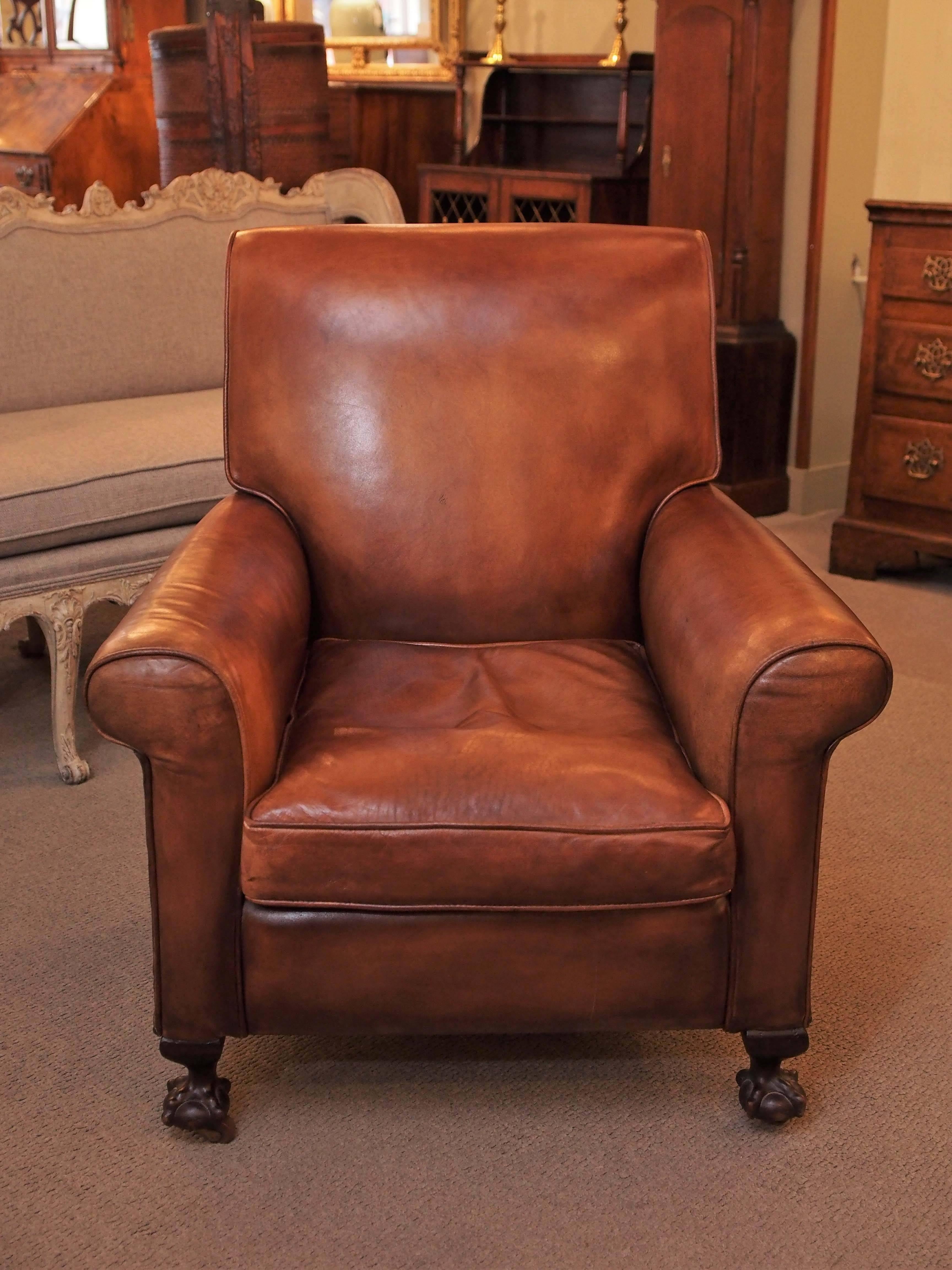 Antique English light brown leather club chair.
