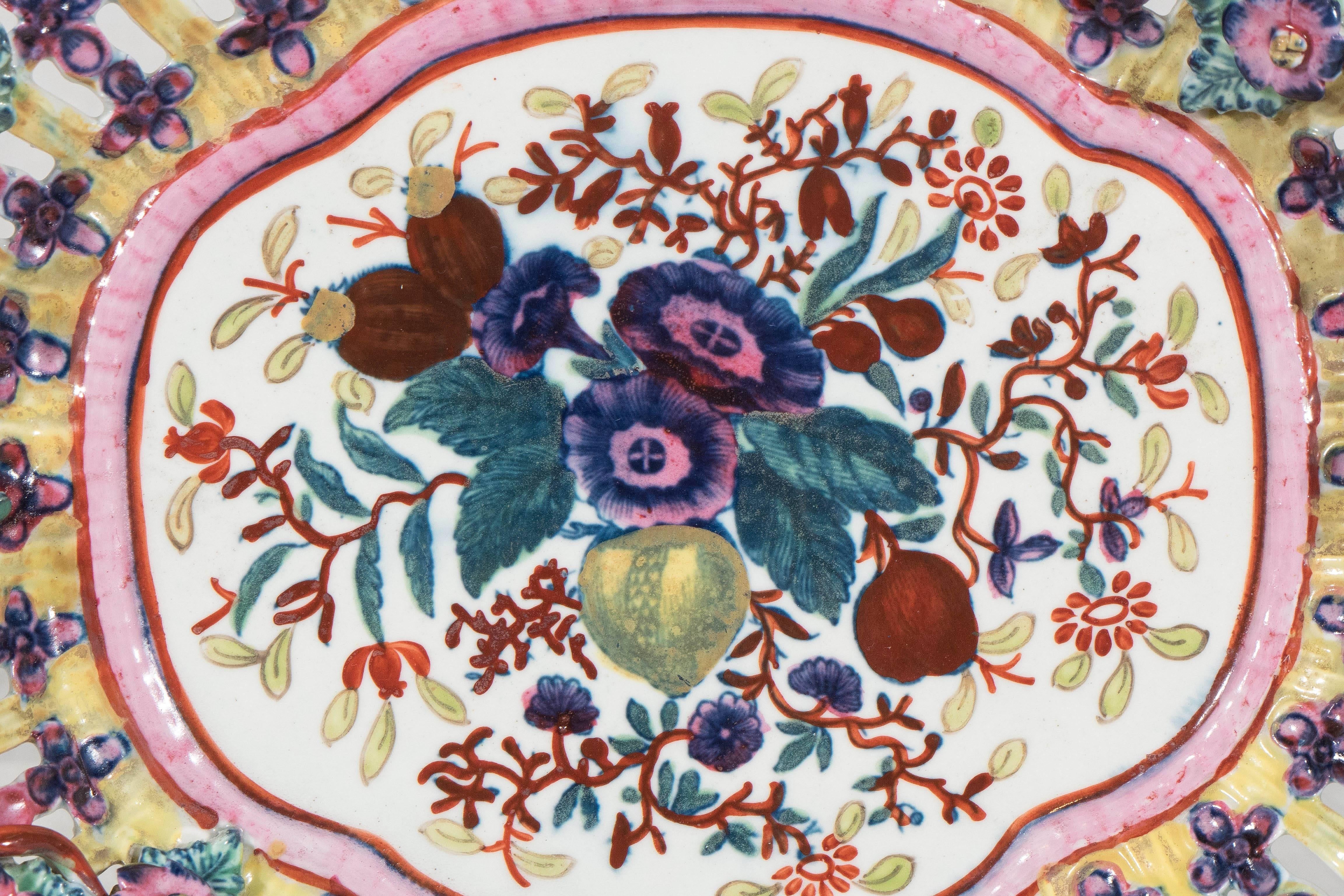 When one thinks of first period Worcester porcelains the very popular blue and white printed porcelains often come to mind. But, in the first period the Worcester factory also made wonderful pieces in colorful polychrome like this pierced dish.