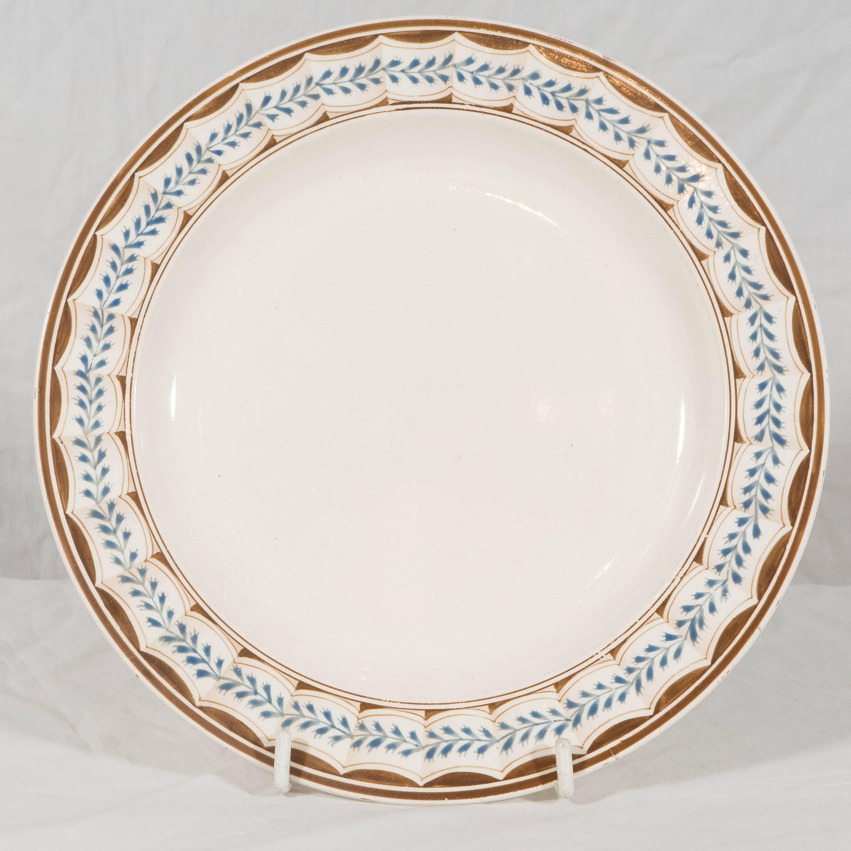 Two pairs of Wedgwood creamware dishes decorated in brown and light blue in the beautiful lag and feather pattern. Wedgwood created the 'lag and feather' pattern to resemble the fluting and husks used in neoclassical metalwork. An illustrated