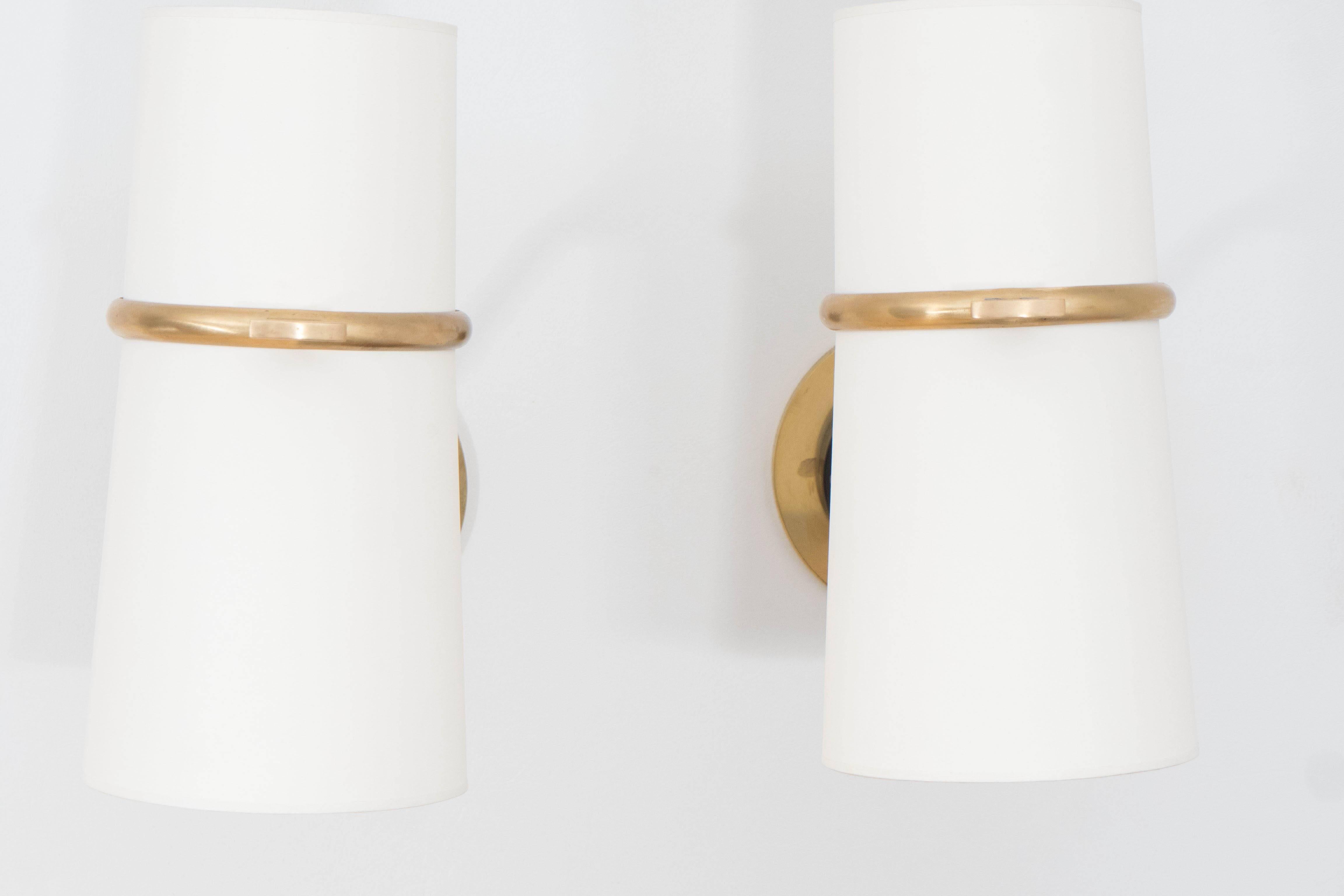 Pair of sconces from French designer Boris Lacroix. Articulated double
shades with double sockets for maximum illumination.
