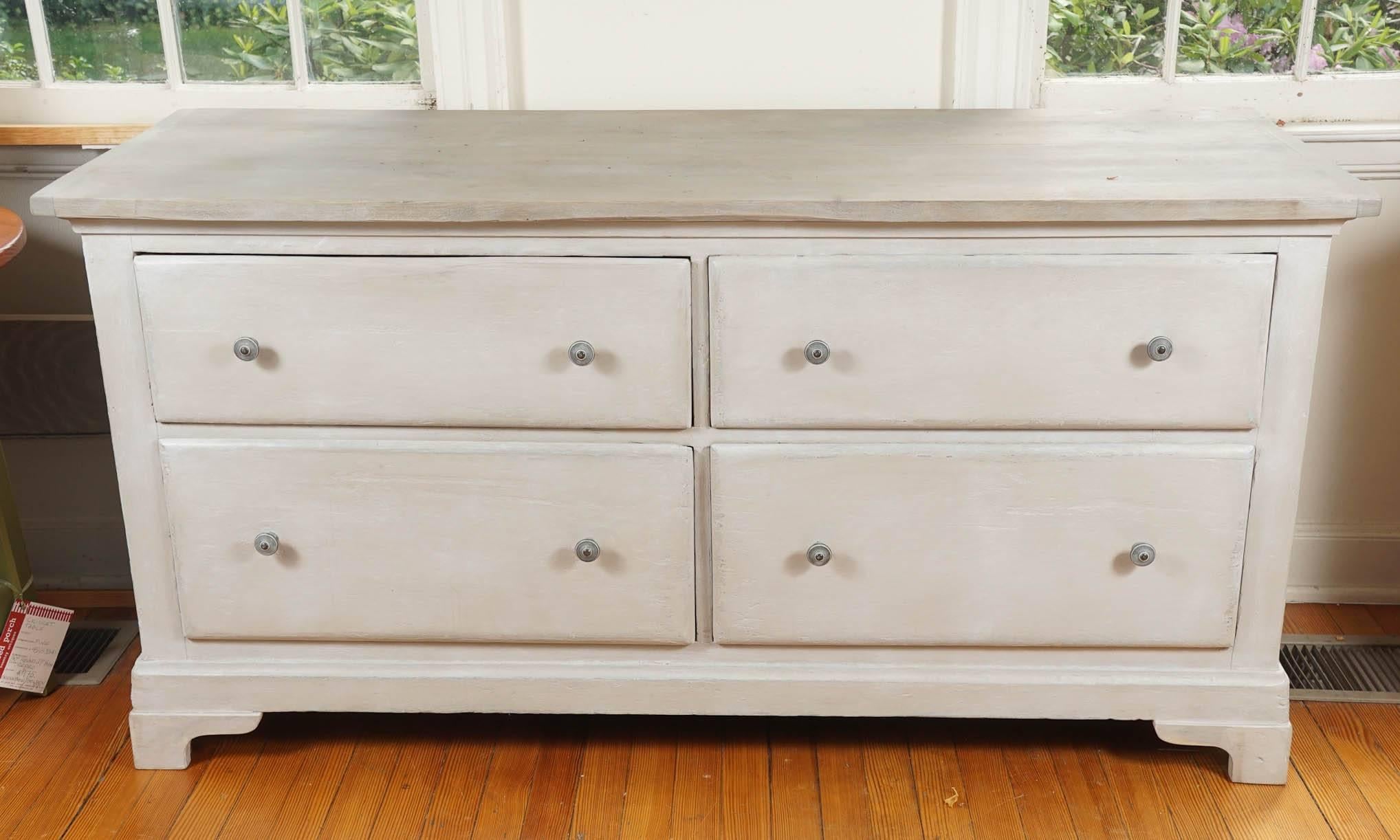 Soft French grey painted base with very pretty darker grey knobs accent this useful dresser, circa 1870. The drawers are spacious and the top is very nice. So are the bracket feet on the bottom. This is a very functional graceful base.