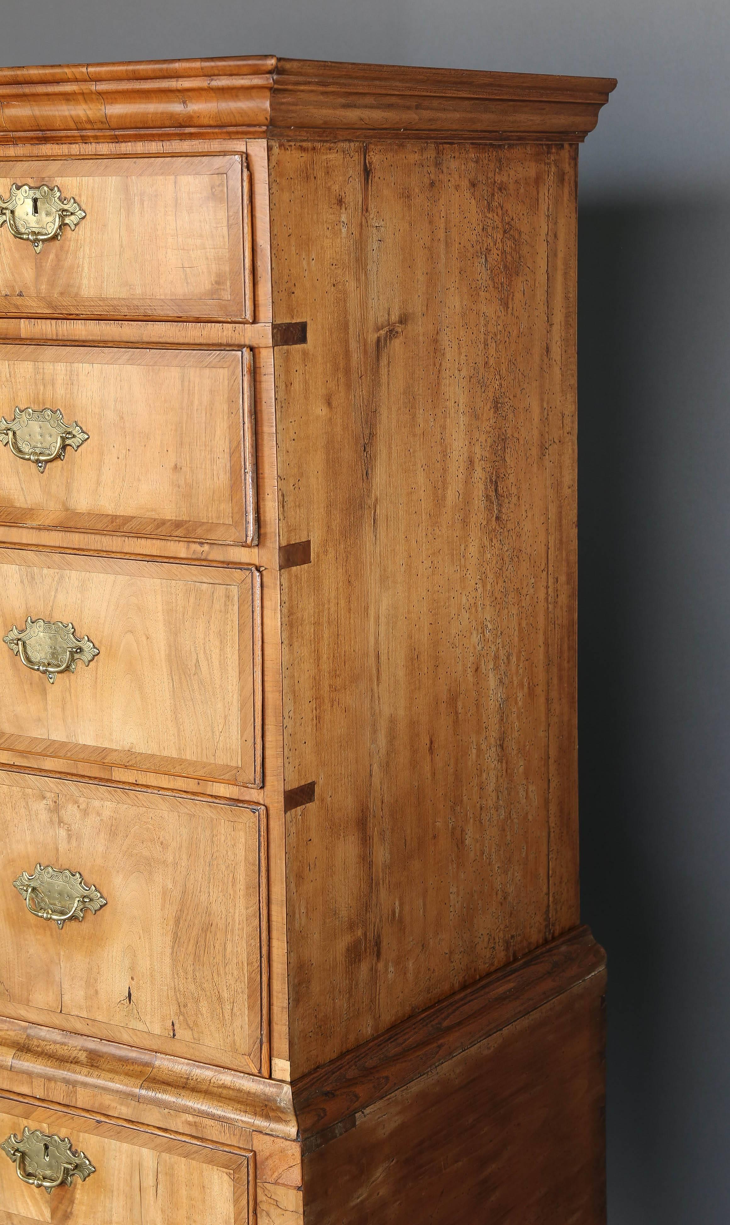 Sun bleached blond walnut 19th century highboy with original oak lined drawers and simple clean lines. Absolutely stunning piece with four short drawers and four long drawers. Often referred to as a chest on chest this piece would look beautiful
