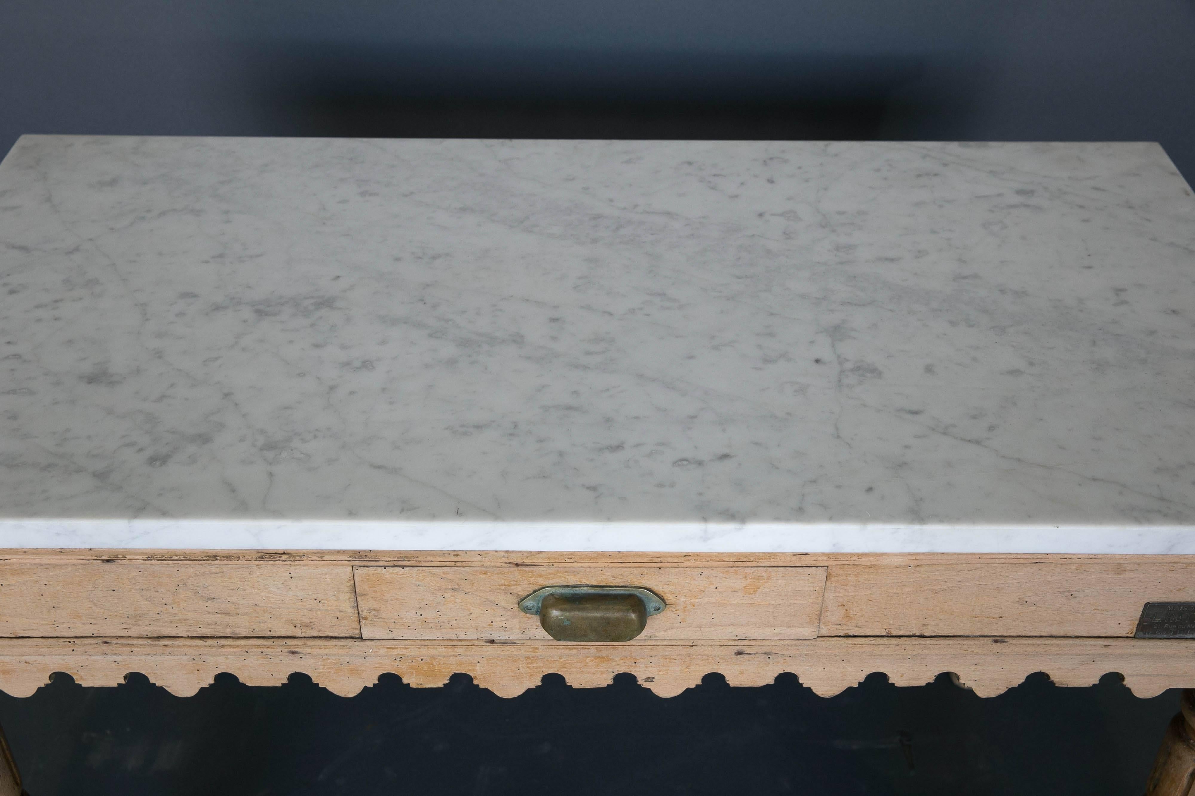 19th century kitchen pastry table with scalloped table skirt, carved legs and white Carrara marble single slab top. Single drawer with original hardware.