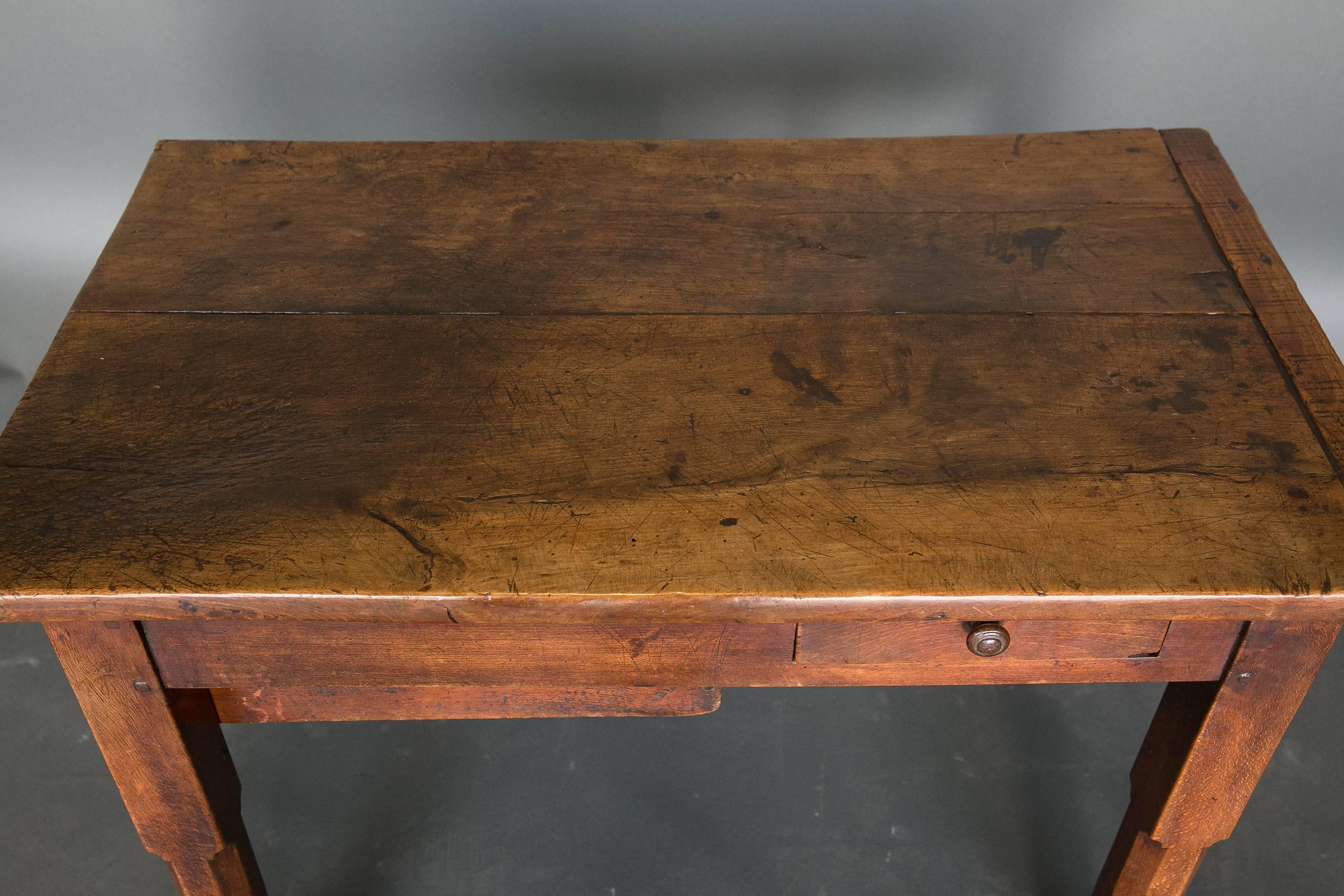 18th century French walnut work table with two drawers, one at the end and another one on one side. Great patina.