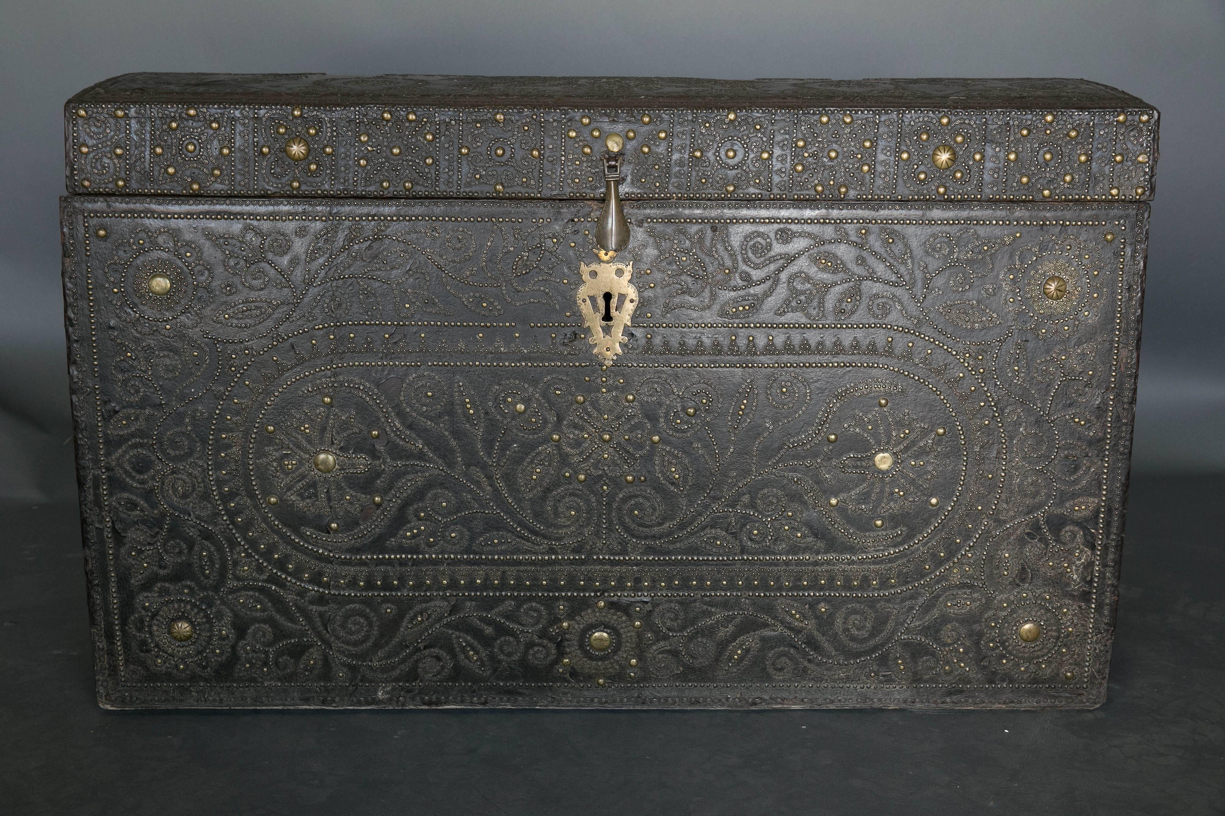 Large antique 18th century Spanish leather studded trunk used by the church due to the inscription of IHS on the top of the trunk. Spectacular workmanship and design. Intricate design on top and front of chest.