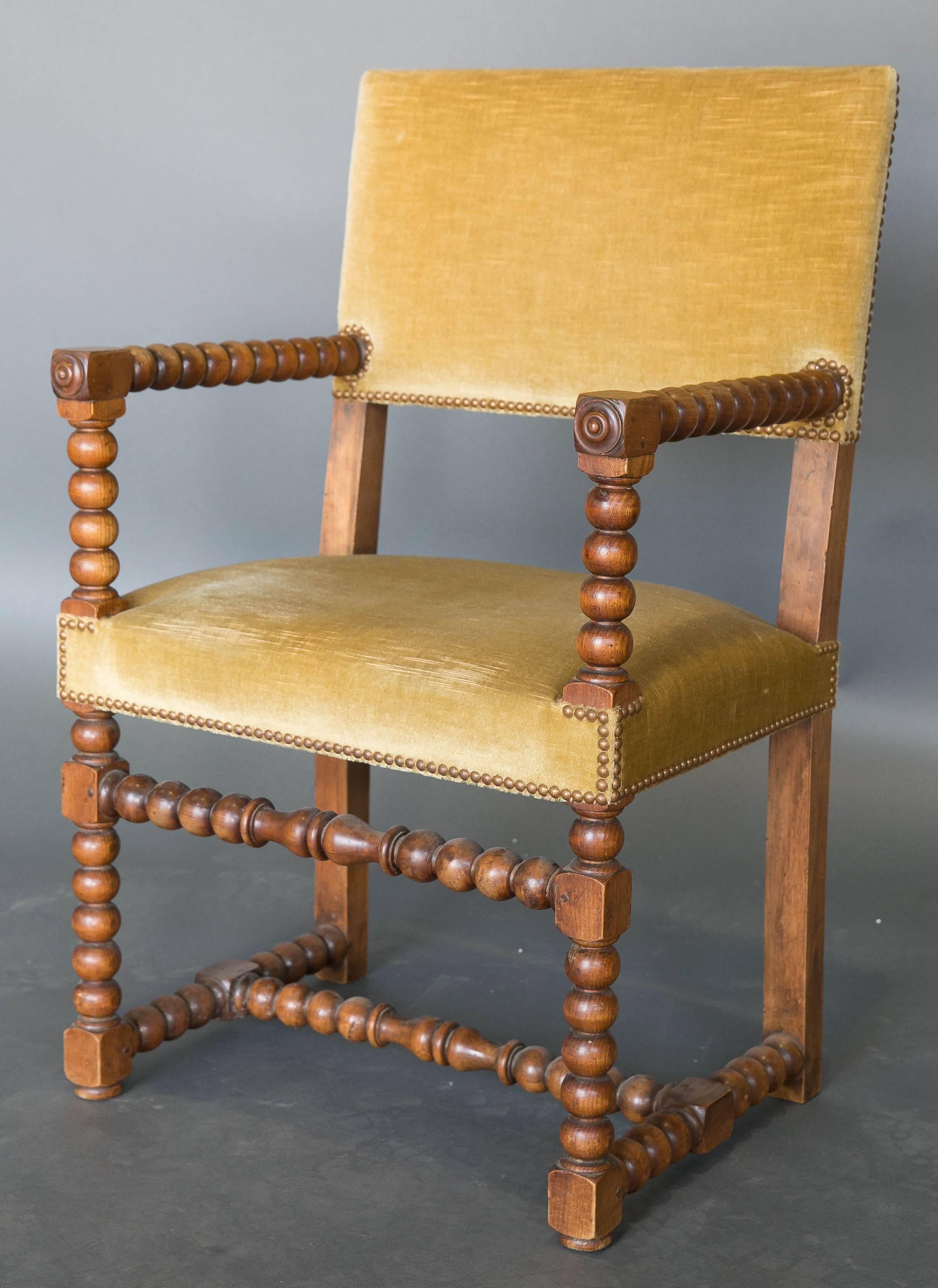 Pair of 19th century carved walnut Bobbin chairs with a single stretcher.