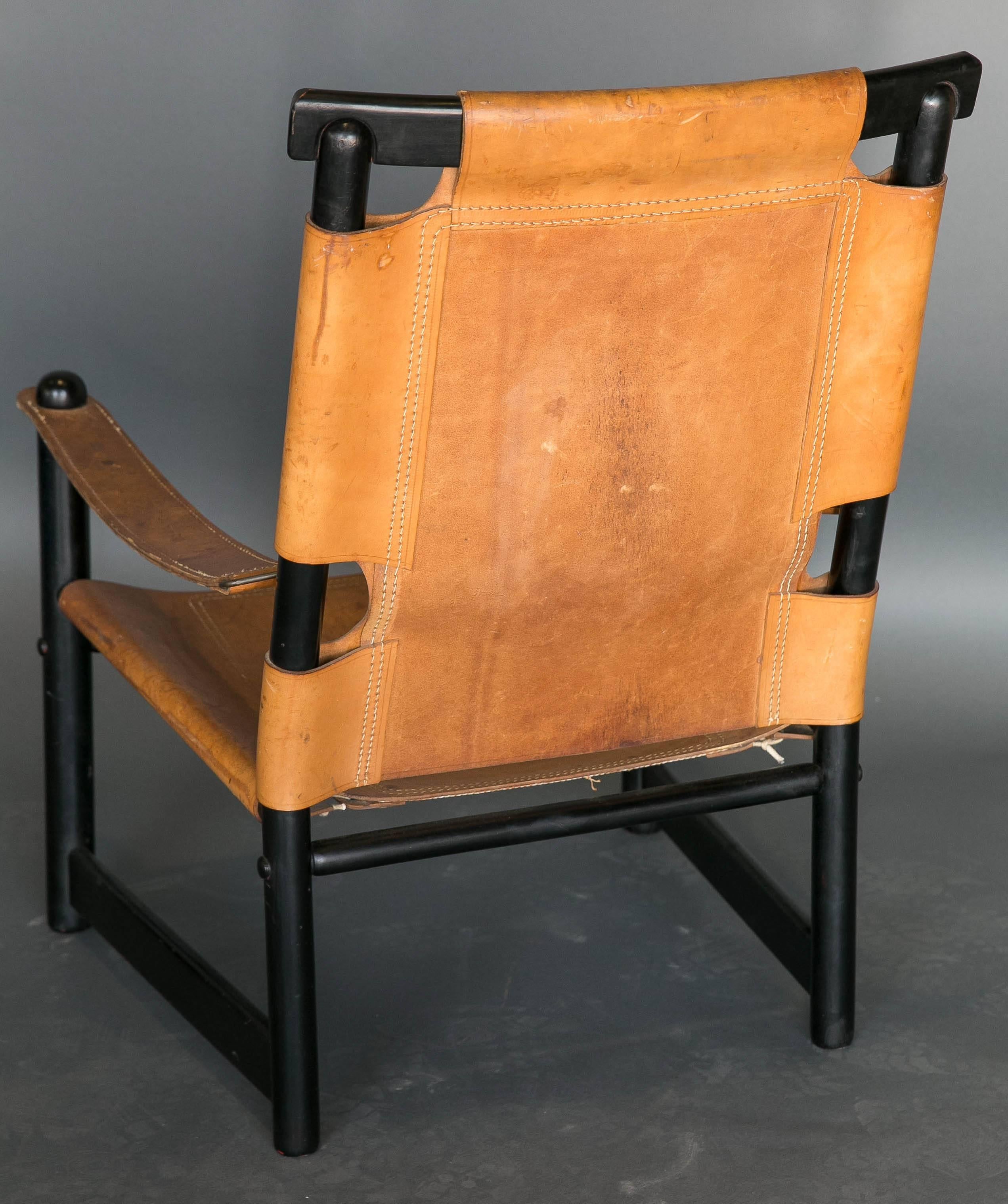 20th Century Mid Century Leather and Ebonized Wood Chair