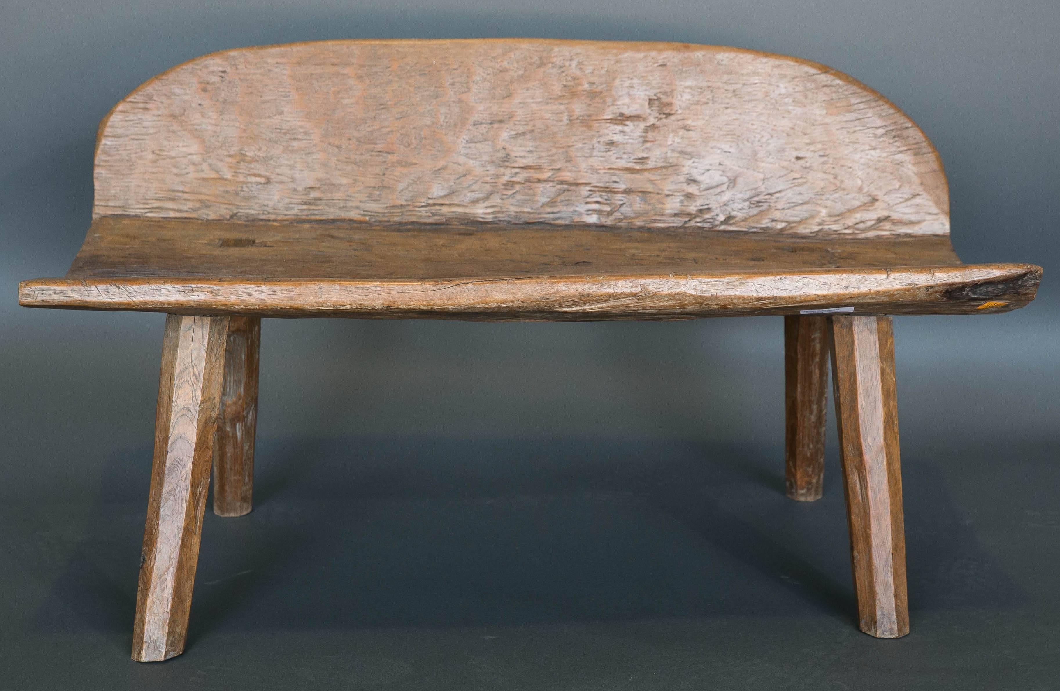 18th century bench from Spanish Pyrenees made from a single dugout trunk. The seat and the back are a solid piece. Beautiful Primitive piece of Folk Art. Made from a chestnut trunk. Seat height is 18