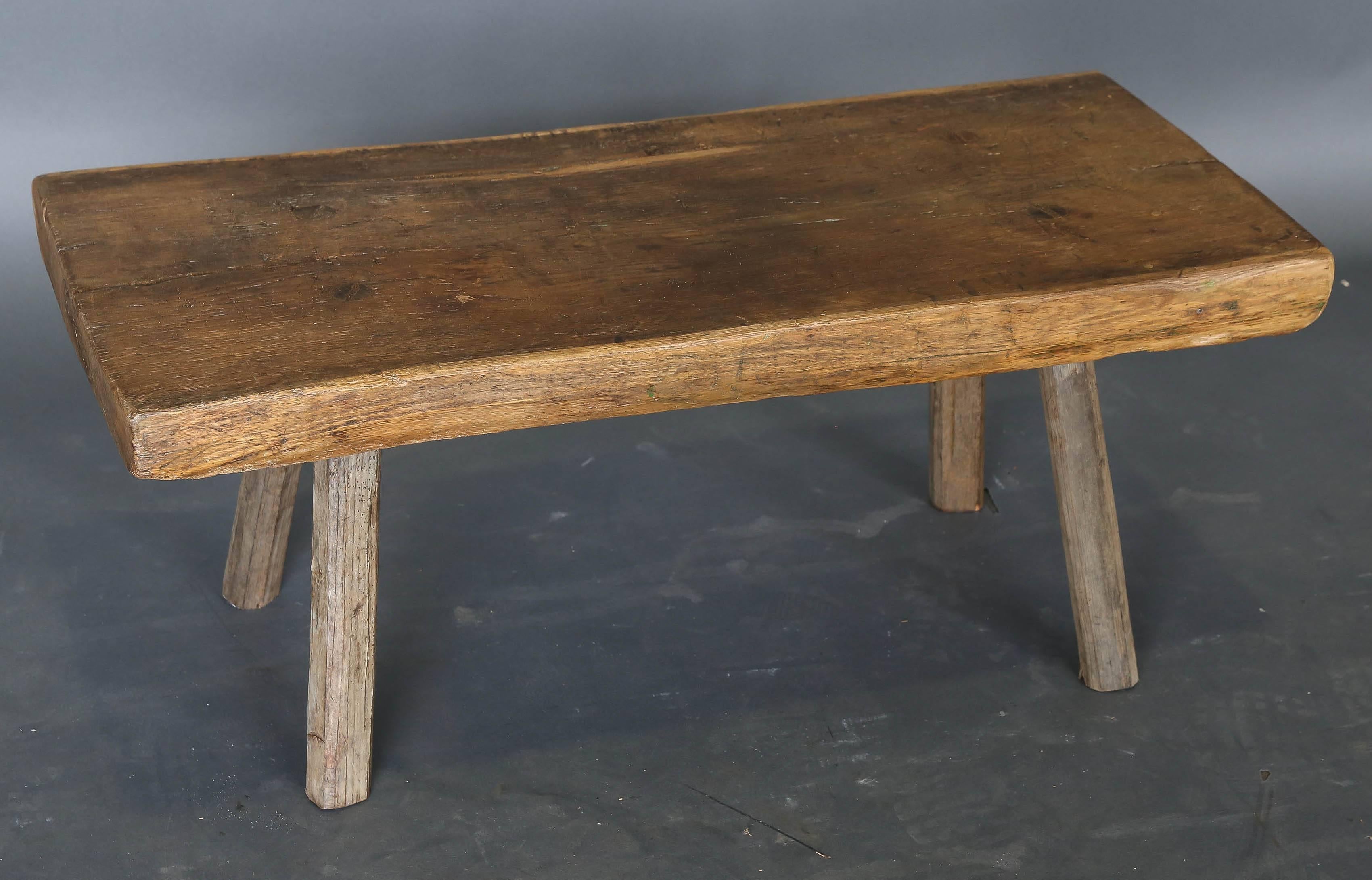 Antique 19th century elm table or bench with thick top slab on four legs. Would make great coffee table.
 