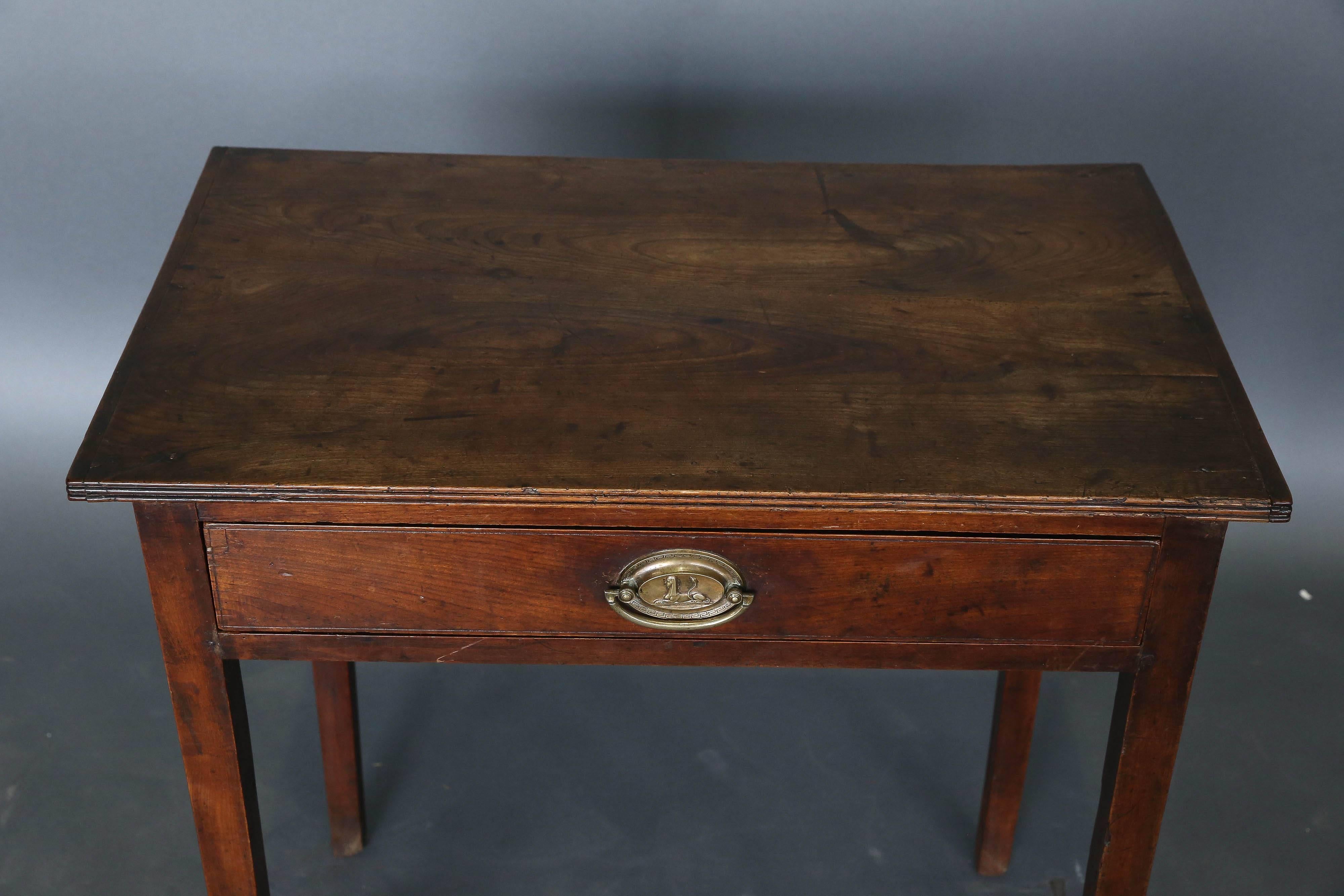19th century mahogany table with original Sphinx hardware and a single drawer on slightly tapered legs.