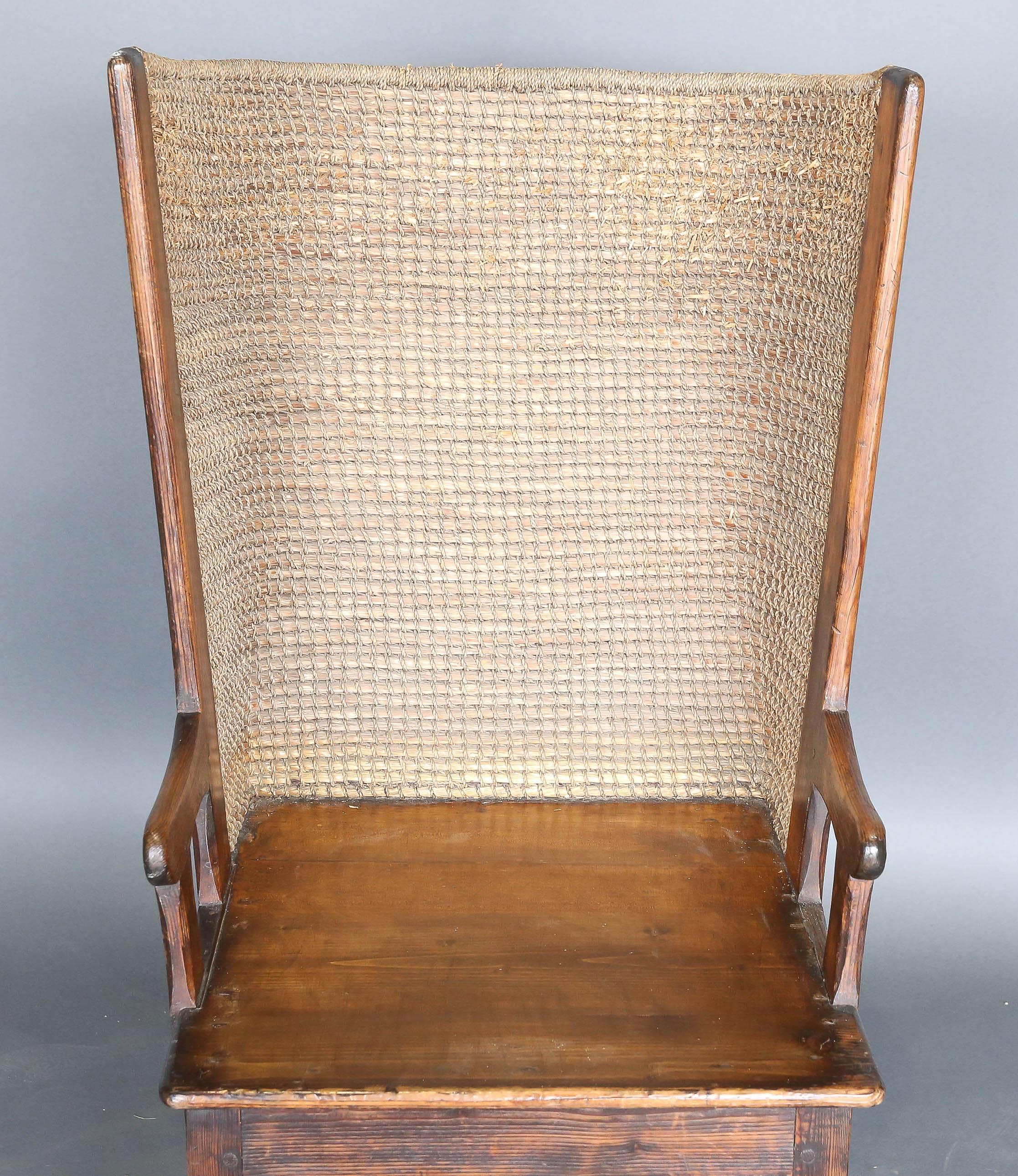 Antique 19th century child's Orkney chair from Scotland made of pine and straw to protect the child from the harsh North Sea winds characteristic of the area. The woven straw back was used because wood was, and continues to be, a precious commodity