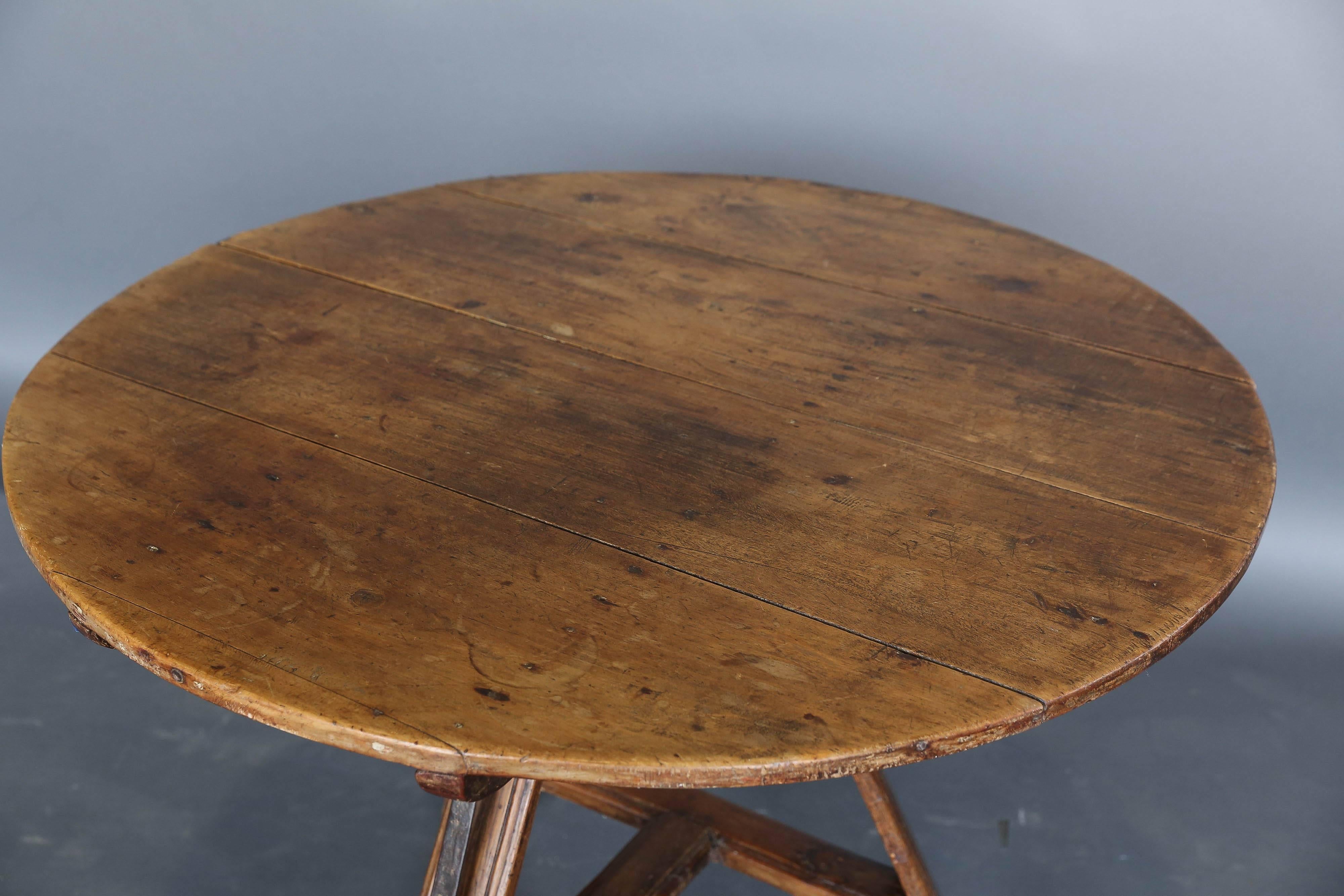 19th century round Dutch tripod table with painting on the round top. Original wrought iron hardware.